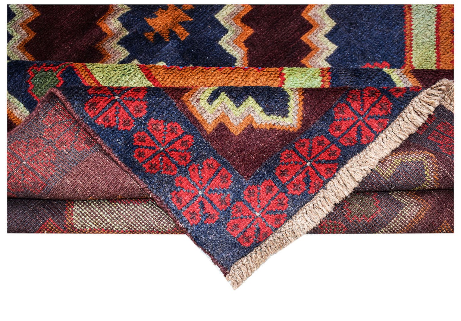 A handmade Afghan Pashm rug featuring a dark geometric pattern with red floral border accents.