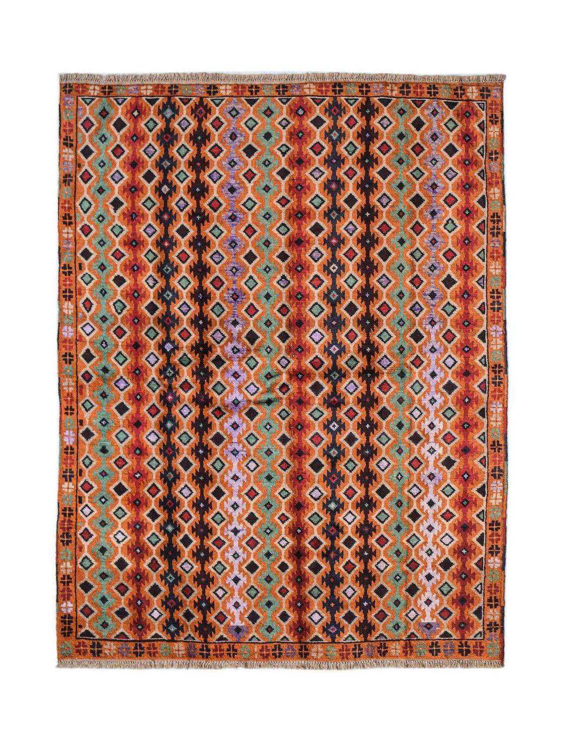 Handmade Afghan Pashm rug featuring a geometric diamond pattern in warm orange, red, and brown.