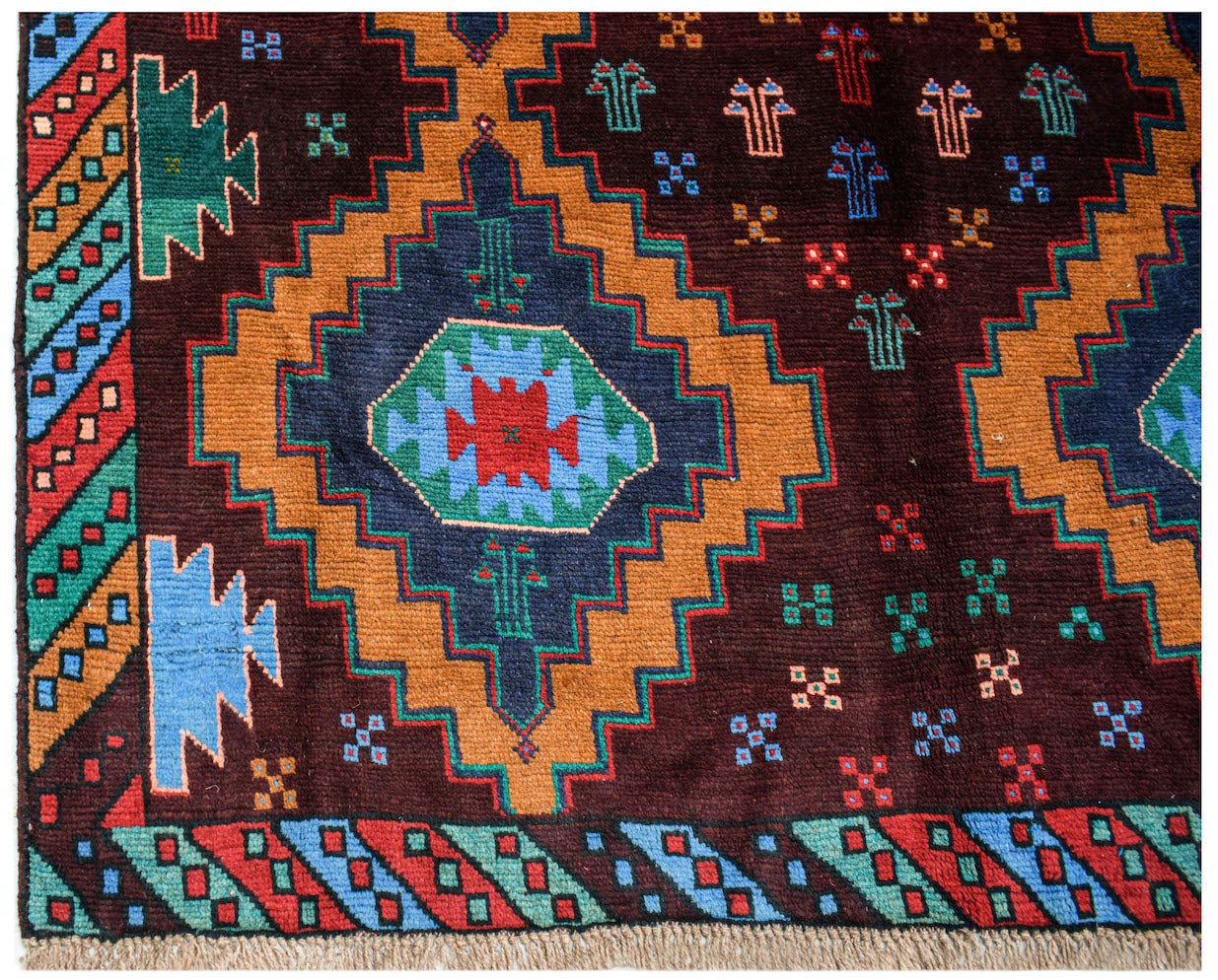 Handmade Afghan Pashm rug featuring a dark brown field with geometric diamond patterns and motifs.
