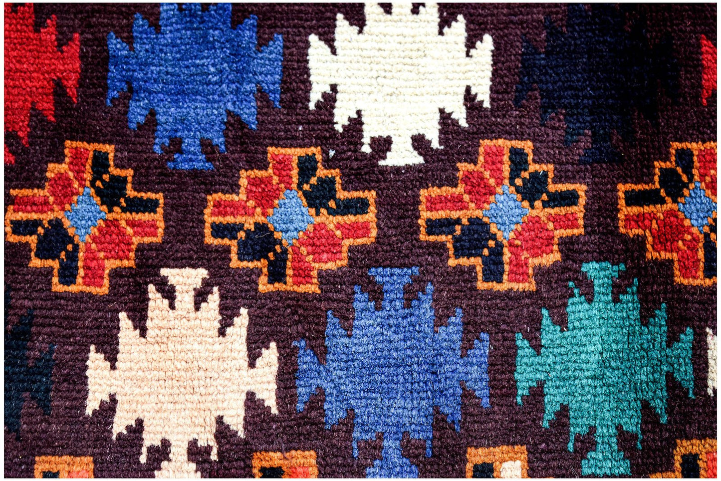 Handmade Afghan Pashm rug featuring a dark brown background with colorful geometric tribal motifs.