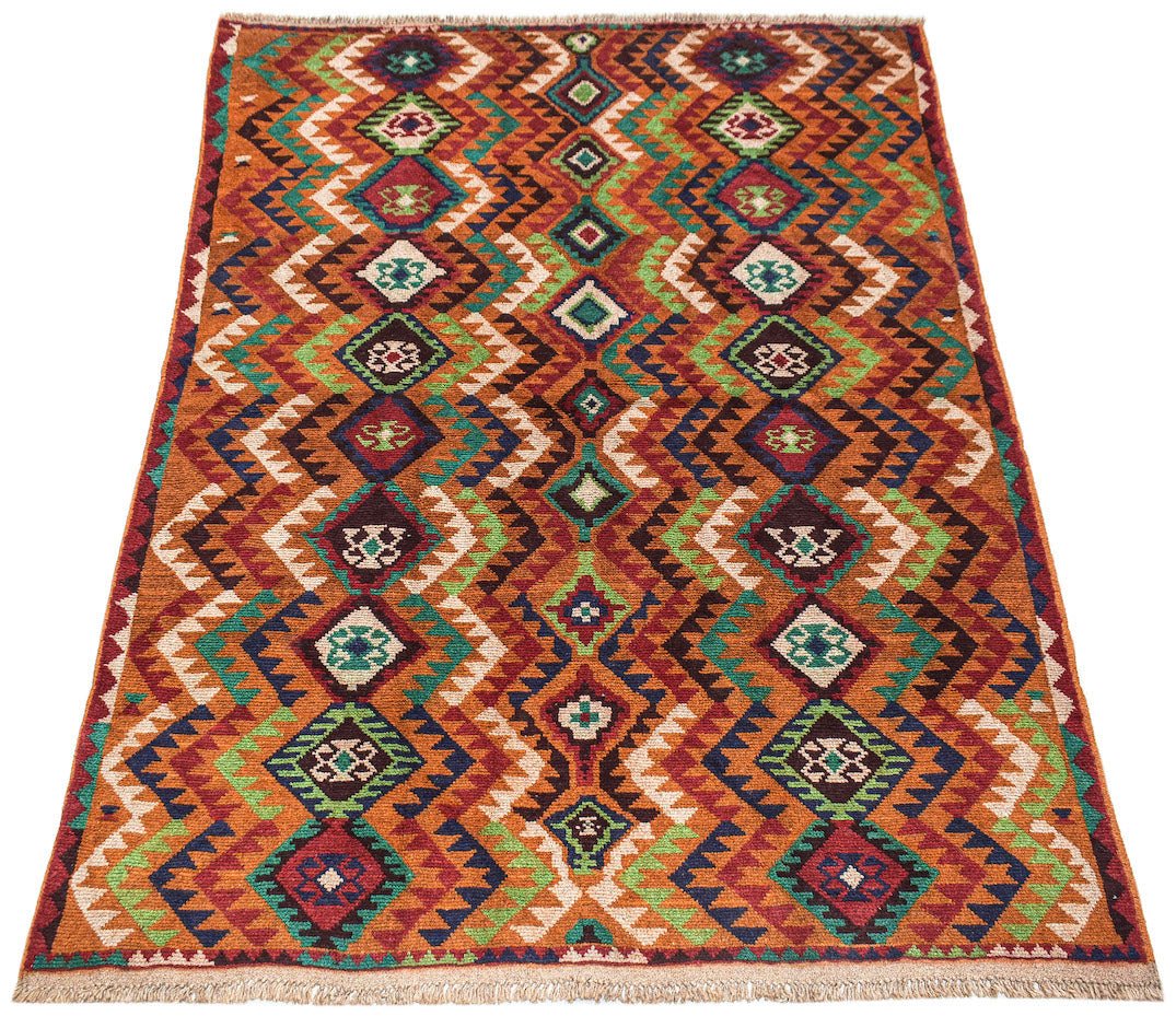 Handmade Afghan Pashm rug featuring a geometric tribal pattern in red, blue, green, and ivory.