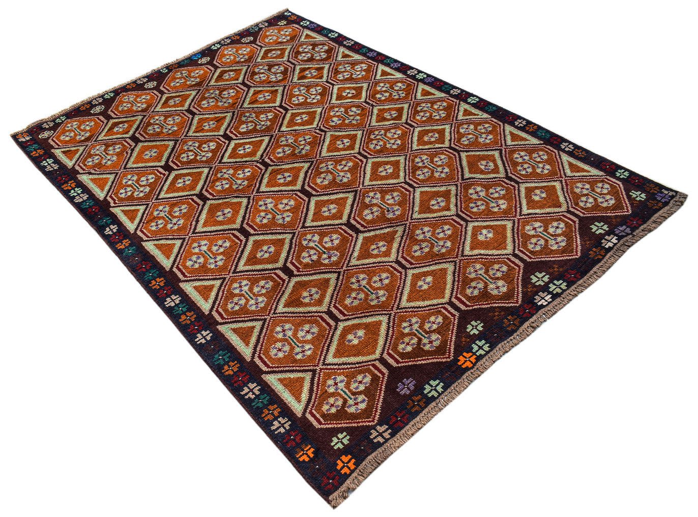 Handmade Afghan Pashm rug featuring a geometric pattern in shades of brown, red, and ivory.
