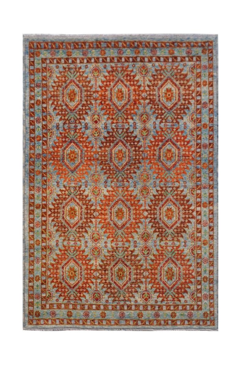 Handmade Afghan wool rug featuring a repeating geometric diamond pattern in orange and blue.