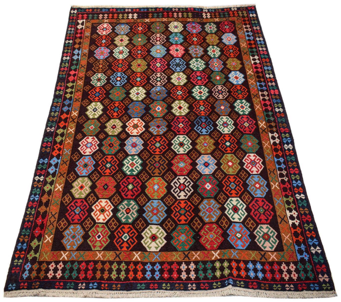 Handmade Afghan Pashm rug featuring a dark field with colorful geometric octagonal motifs.