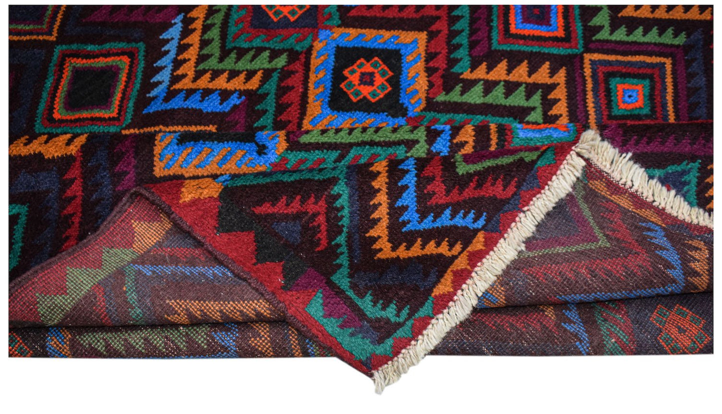 A handmade Afghan Pashm rug featuring a geometric tribal pattern in dark red, blue, and orange.