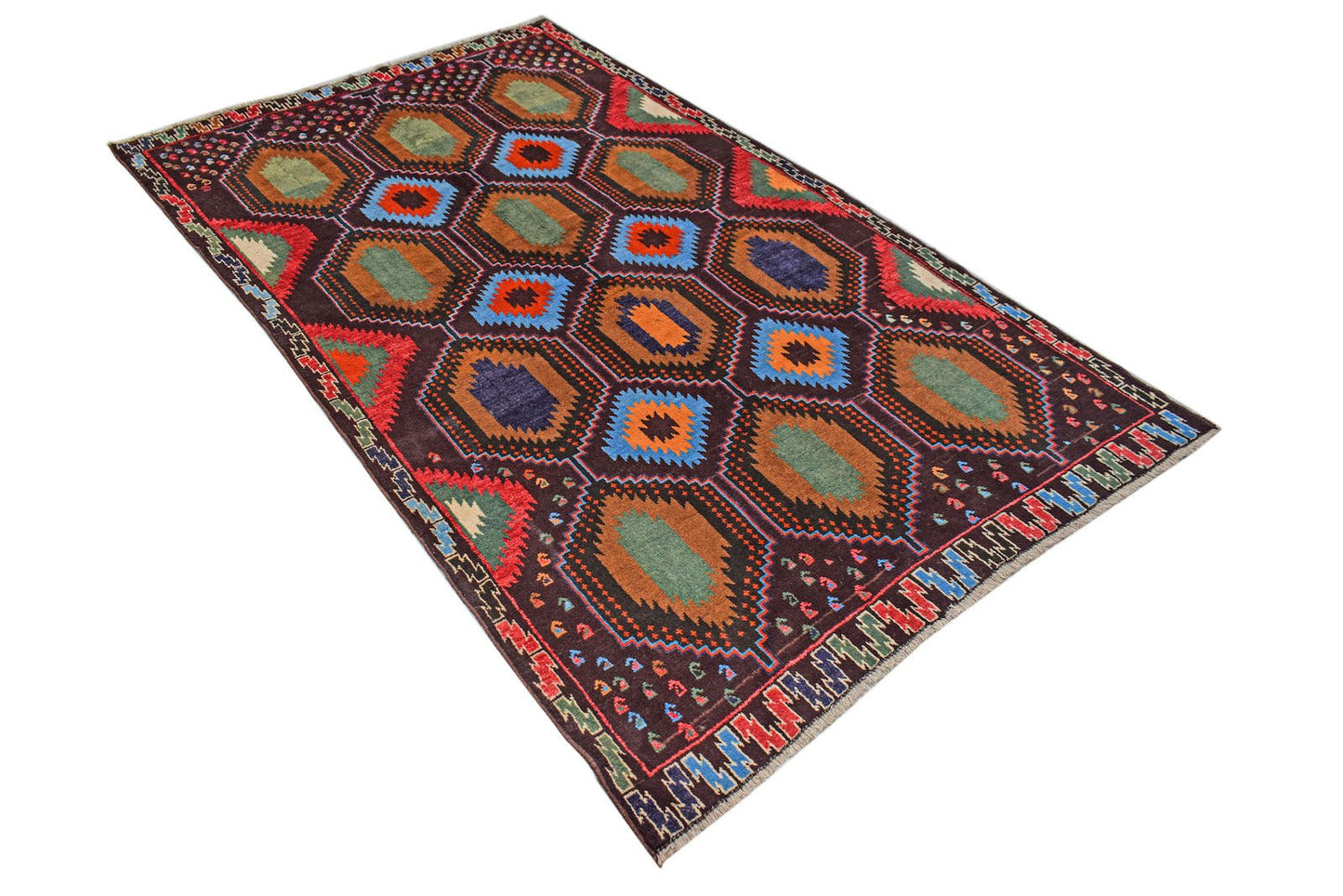 Handmade Afghan Pashm rug featuring a dark brown field with repeating geometric hexagon motifs.