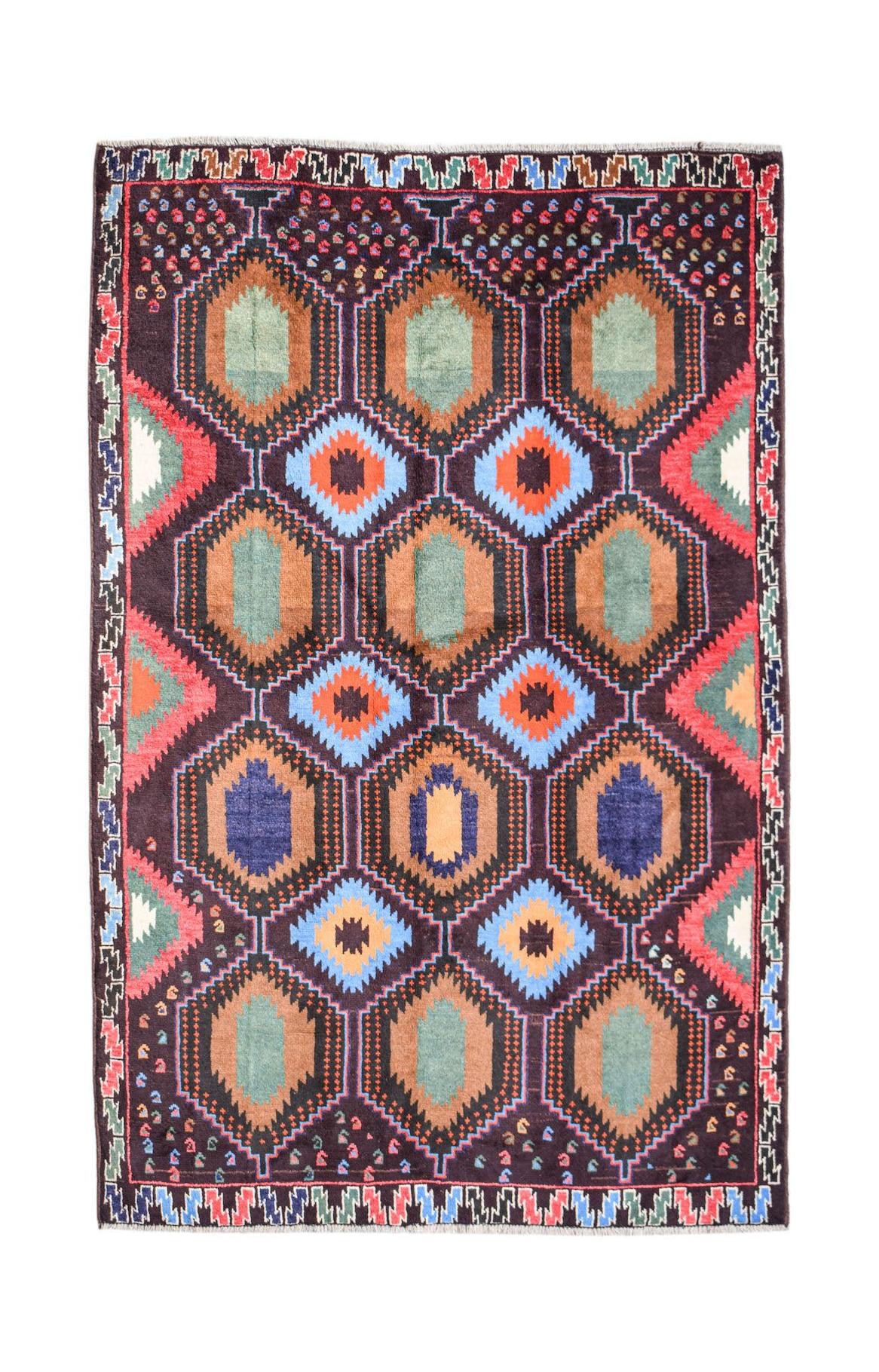Handmade Afghan Pashm rug featuring a geometric pattern of hexagons in blue, brown, and red tones.