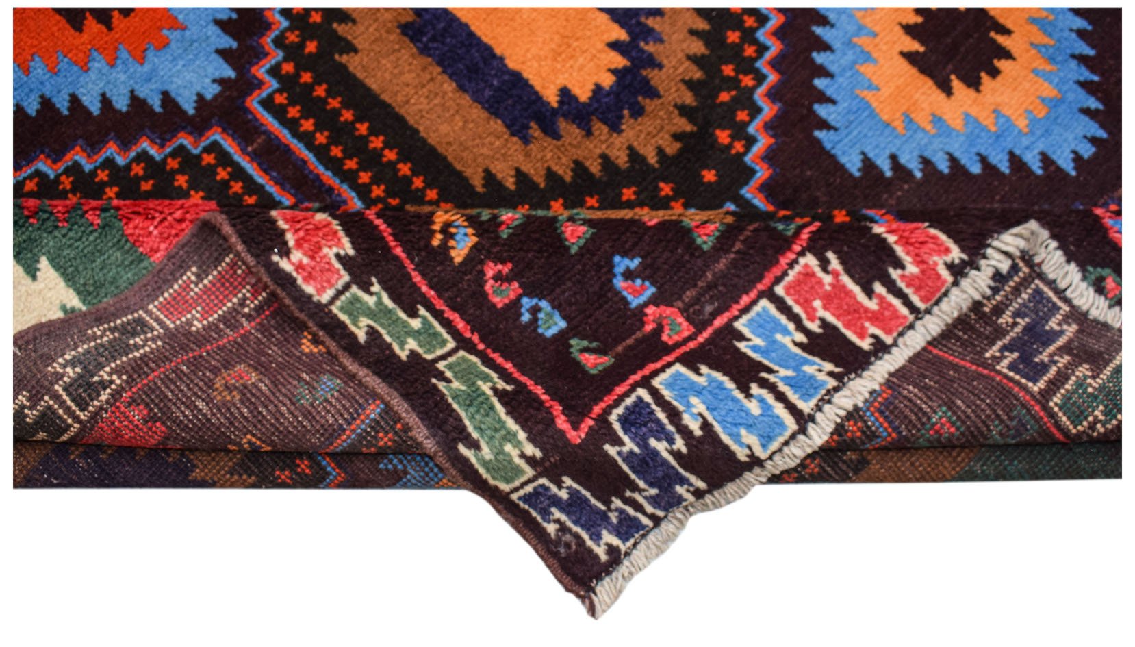 A handmade Afghan Pashm rug featuring a geometric tribal pattern in dark red, blue, and brown.