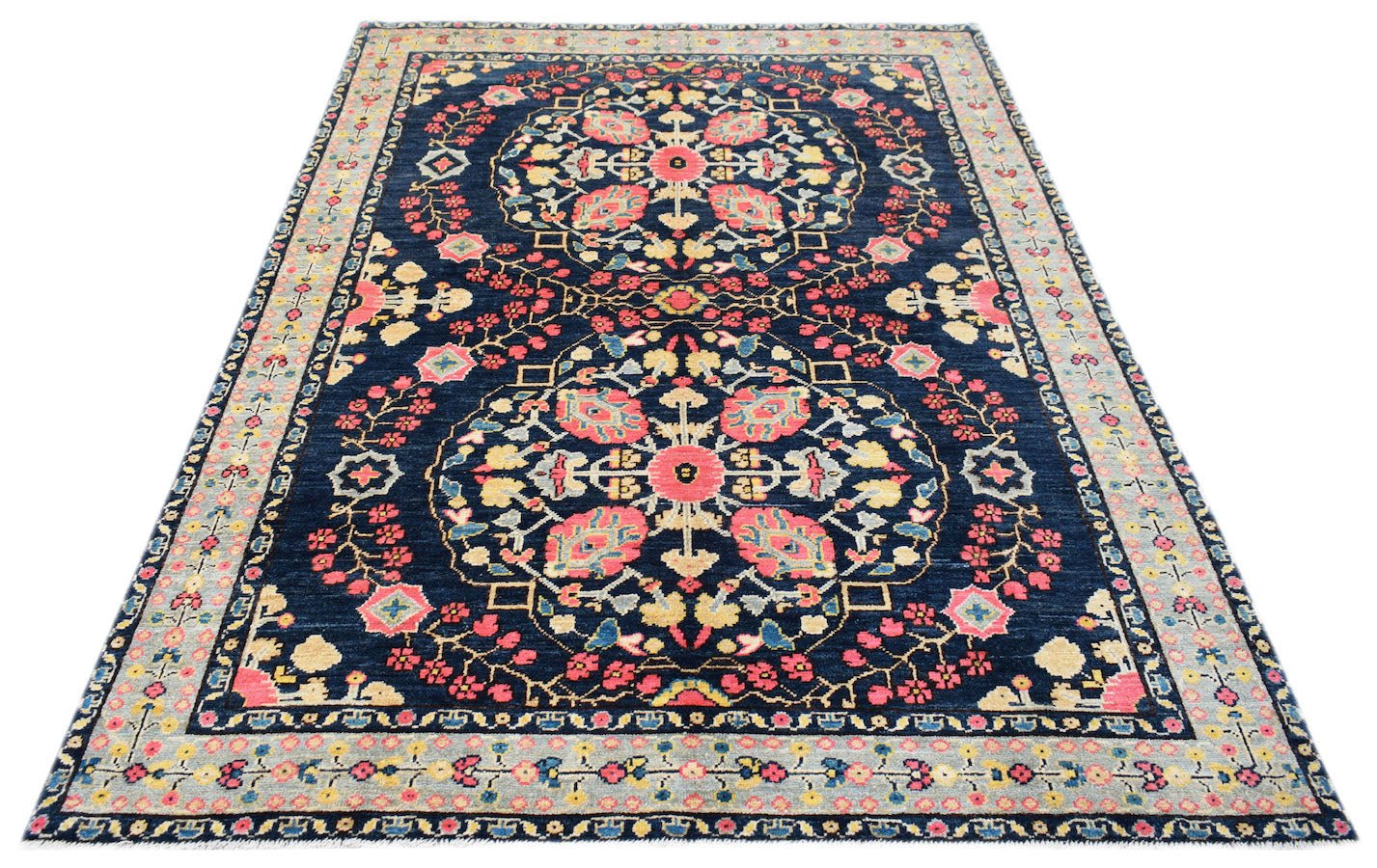 Handmade Afghan Pashm rug featuring a dark blue field with two large floral medallions.
