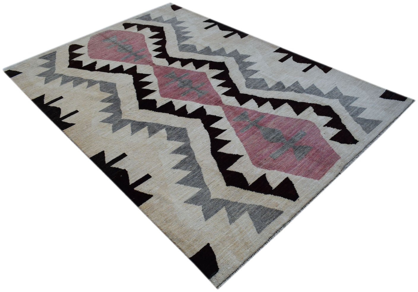 Handmade Afghan wool rug featuring a geometric tribal pattern in pink, grey, and black.