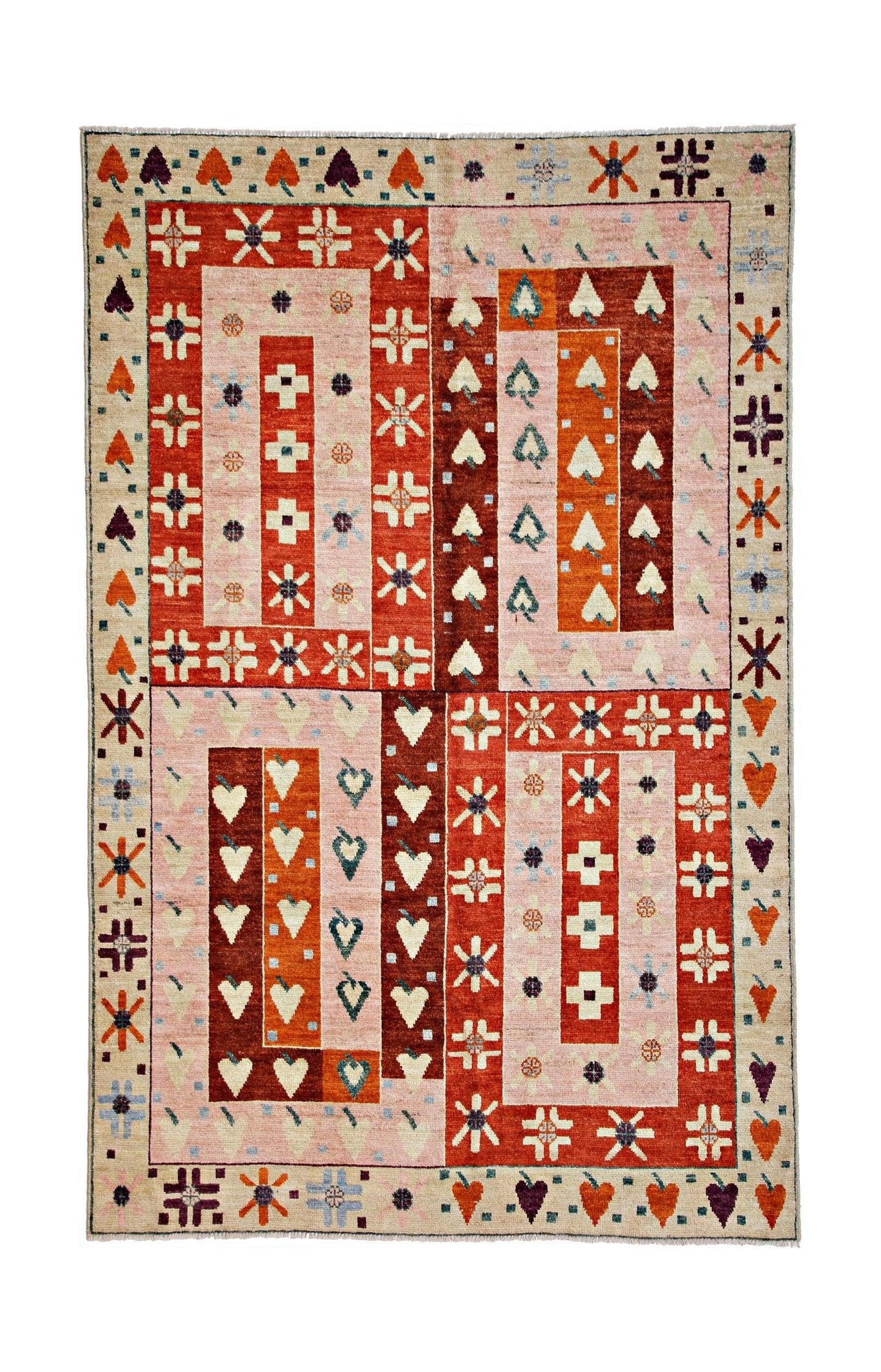 Handmade wool rug featuring a geometric patchwork design in shades of pink, orange, and red.