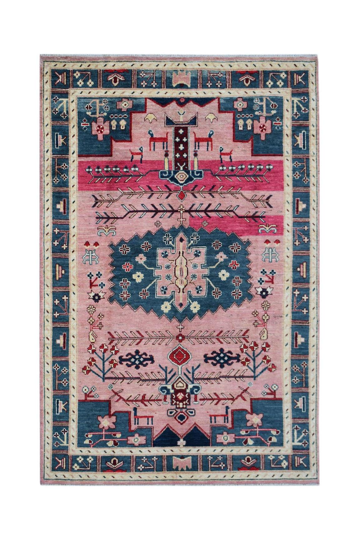 Handmade Afghan wool rug featuring a pink field with blue geometric tribal motifs and borders.