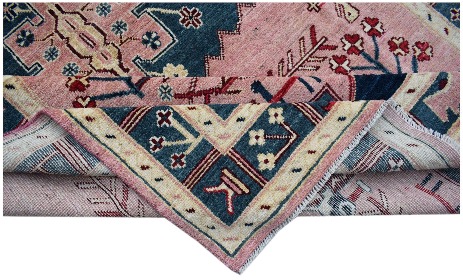 A handmade Afghan wool rug featuring a traditional tribal pattern in shades of pink and blue.