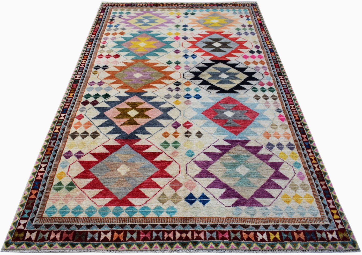 Handmade Afghan wool rug featuring a colorful geometric diamond pattern on a cream background.
