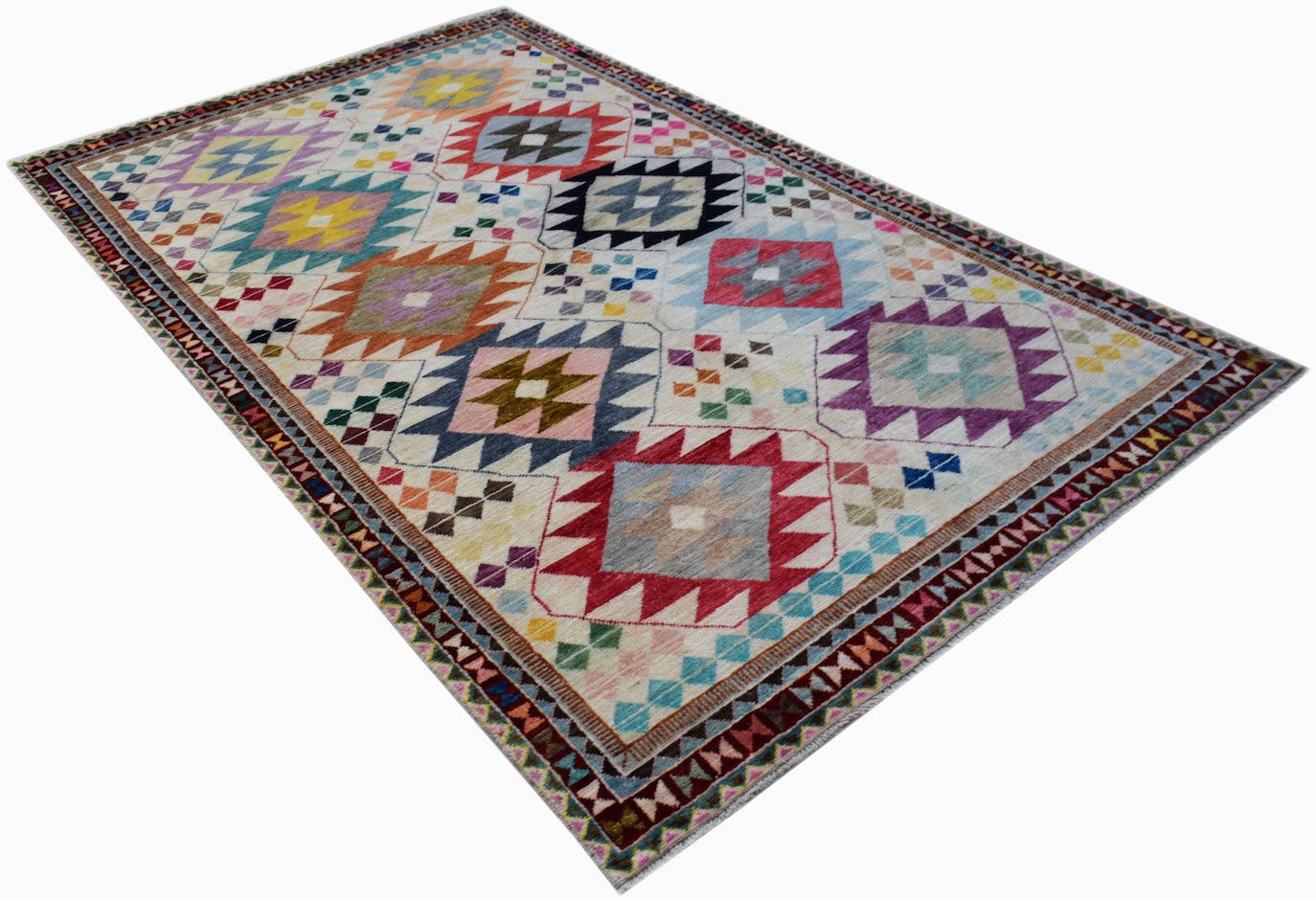 Handmade Afghan wool rug featuring a colorful geometric tribal pattern on a cream background.