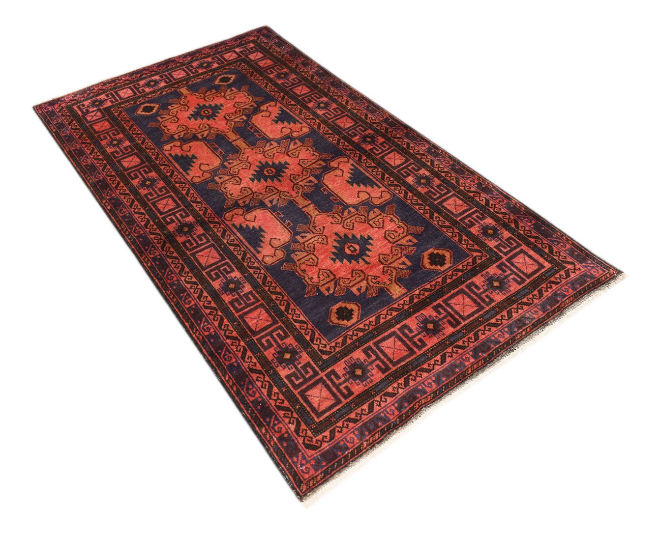 A vintage handmade Afghan Baluch rug featuring geometric patterns in red and dark blue tones.