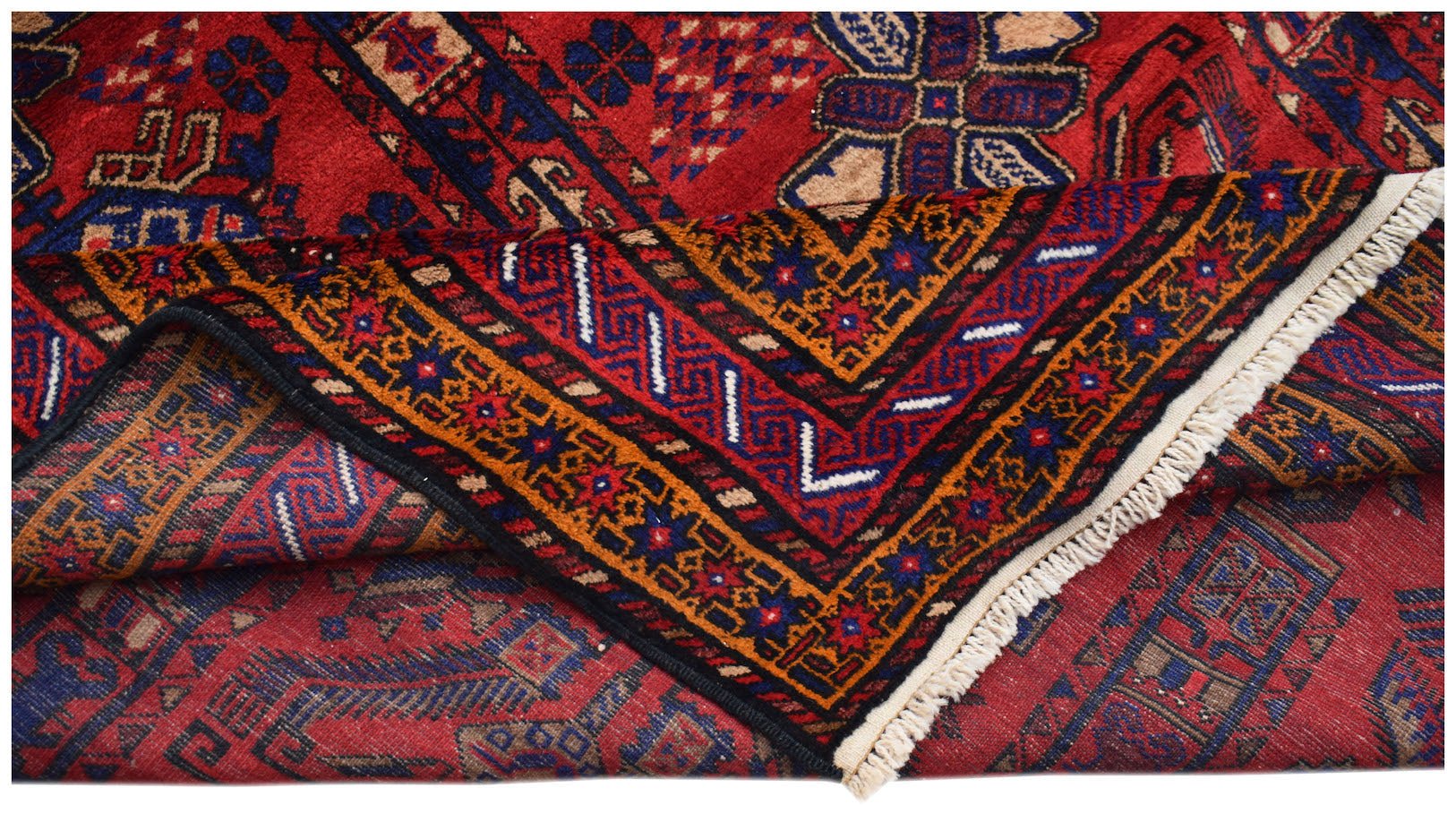 A vintage Afghan Baluch rug featuring intricate geometric patterns in red, blue, and orange wool.