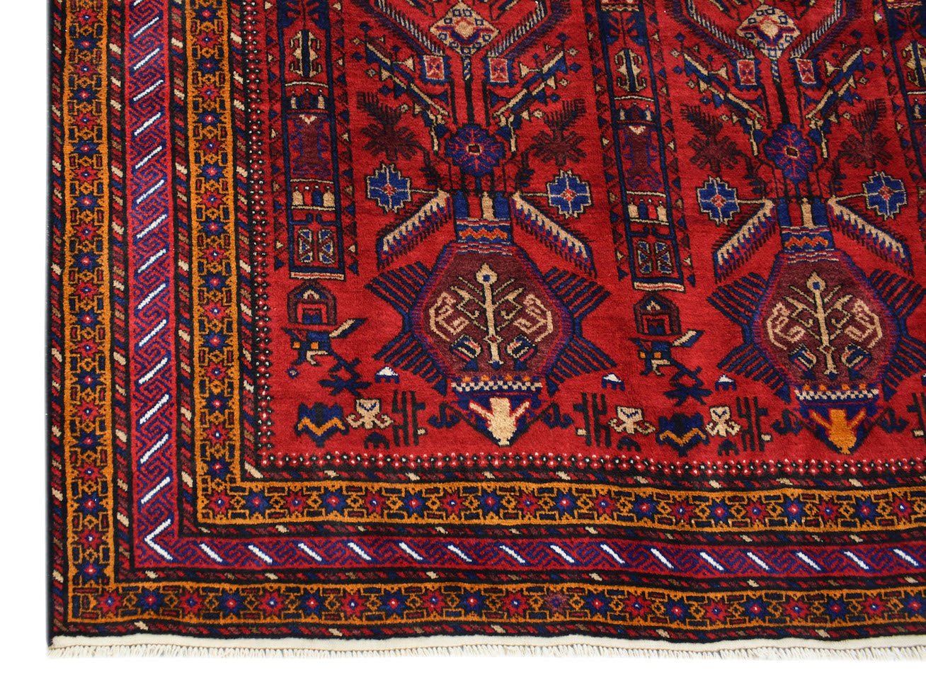 A vintage Afghan Baluch rug featuring traditional geometric patterns in red, blue, and gold.