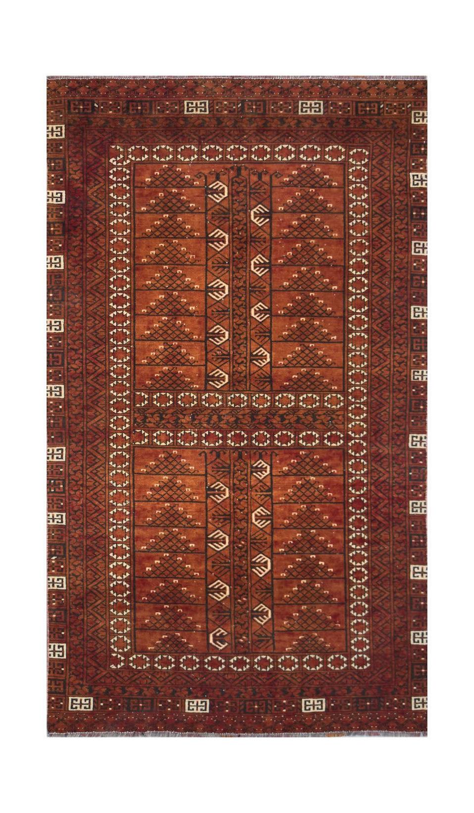 A vintage handwoven Afghan Turkmen rug featuring geometric patterns in shades of deep red.