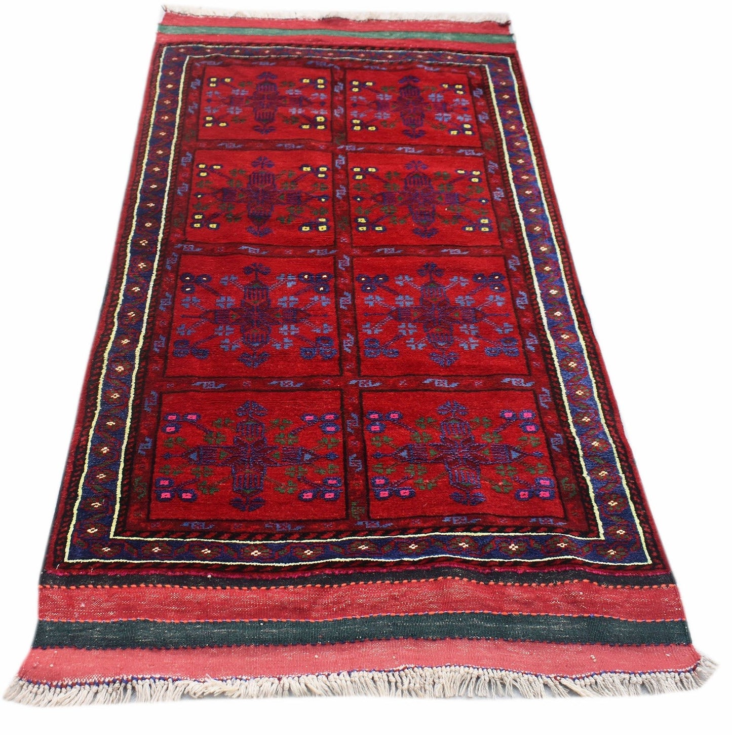 A vintage handwoven Afghan Baluch rug featuring a red field with repeating geometric floral motifs.