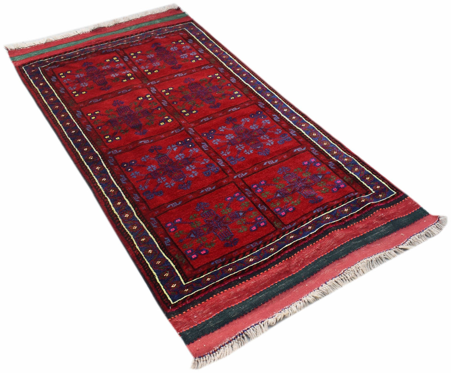 A vintage handwoven Afghan Baluch rug featuring a red field with repeating geometric floral motifs.