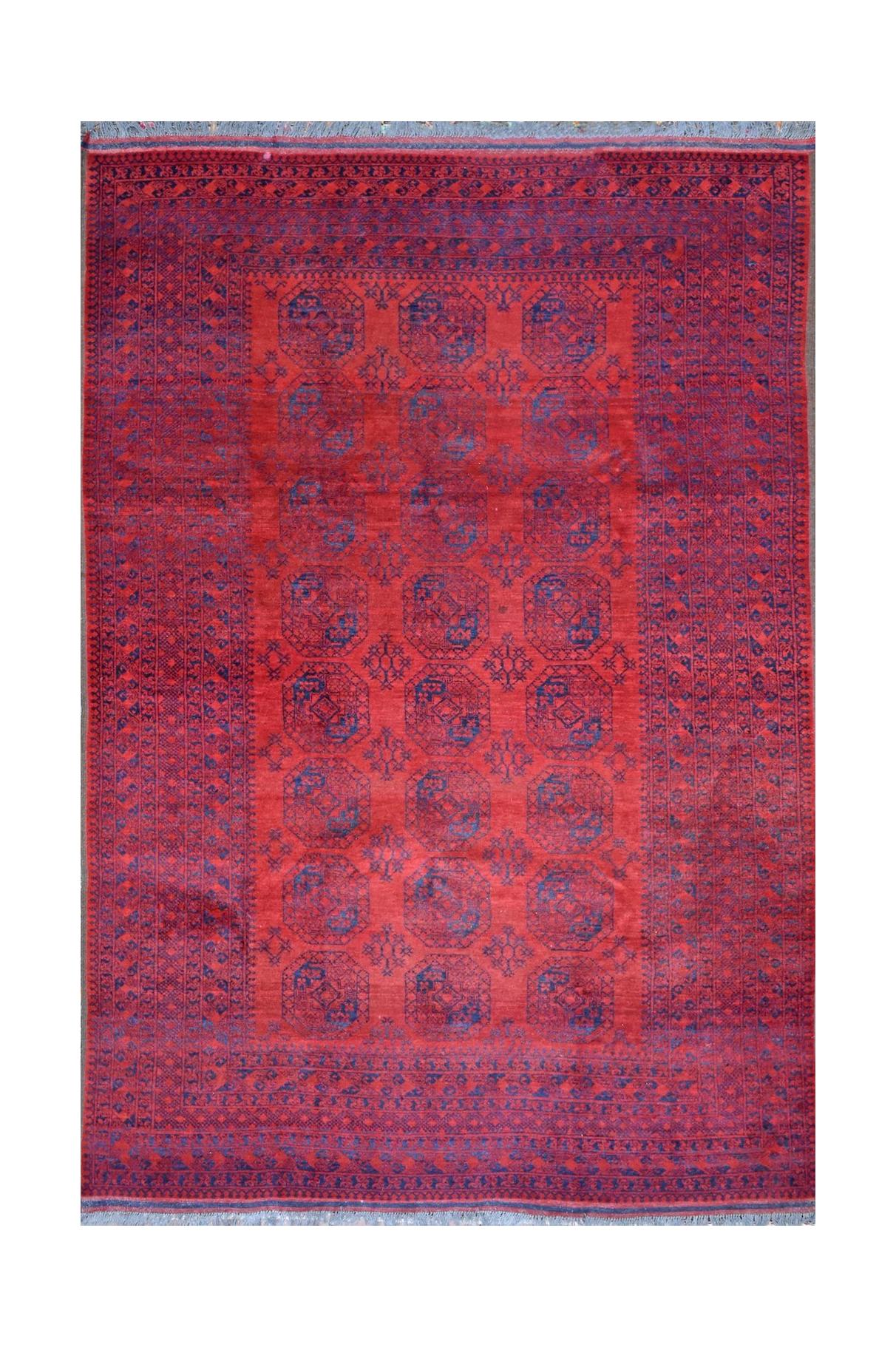 A vintage handmade Afghan Turkmen rug featuring a repeating geometric pattern in red and blue.