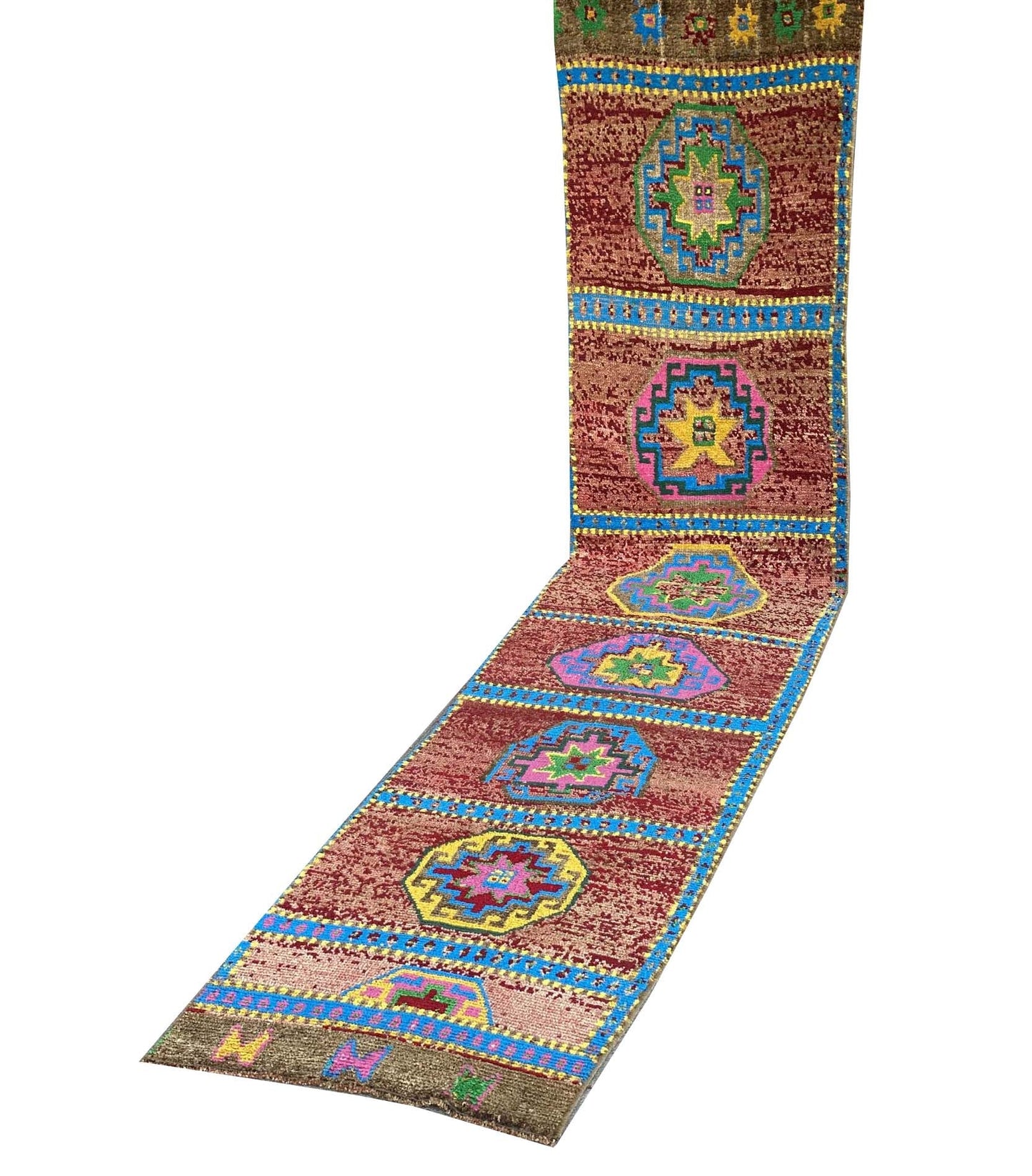 A vintage Kurdish Herki runner featuring geometric medallions in vibrant colors on a red field.