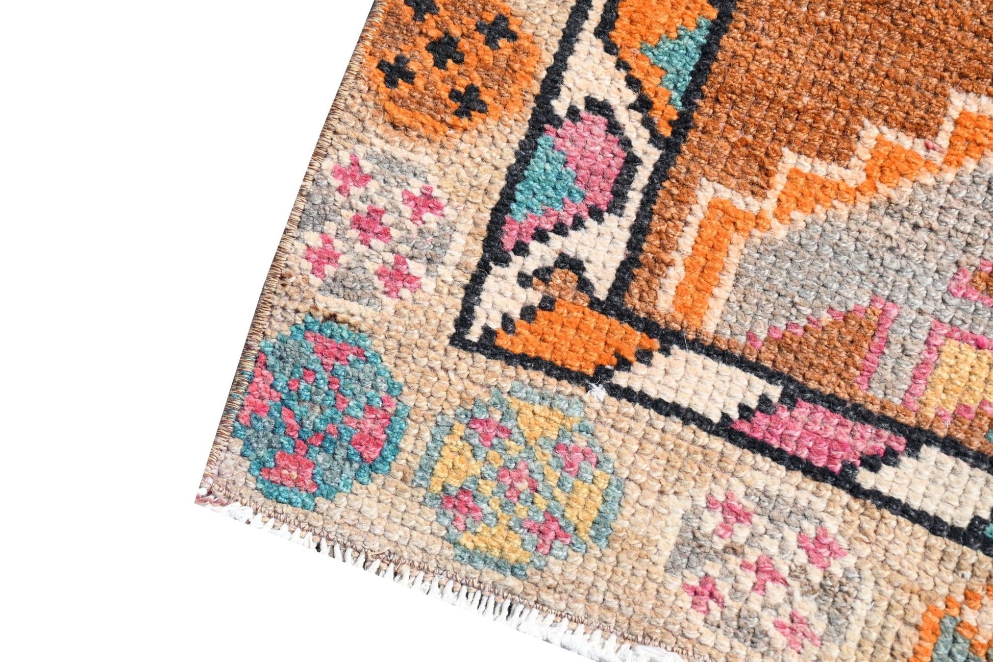 Vintage Kurdish Herki runner with tribal motifs in orange, pink, and teal.