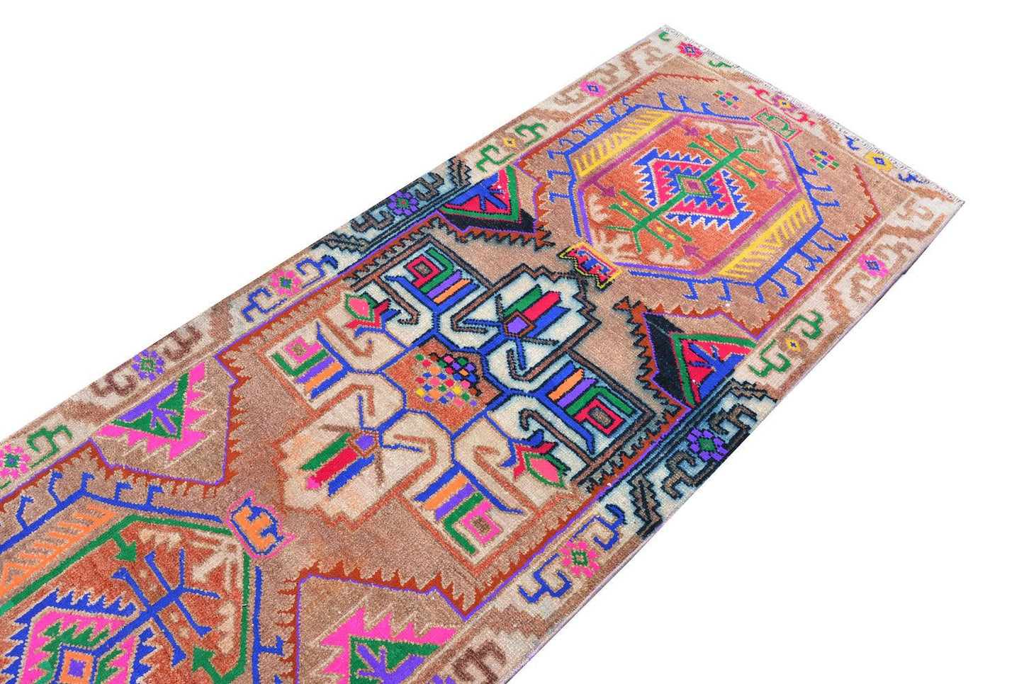 A vintage Kurdish Herki runner featuring tribal motifs in vibrant neon colors on a wool base.