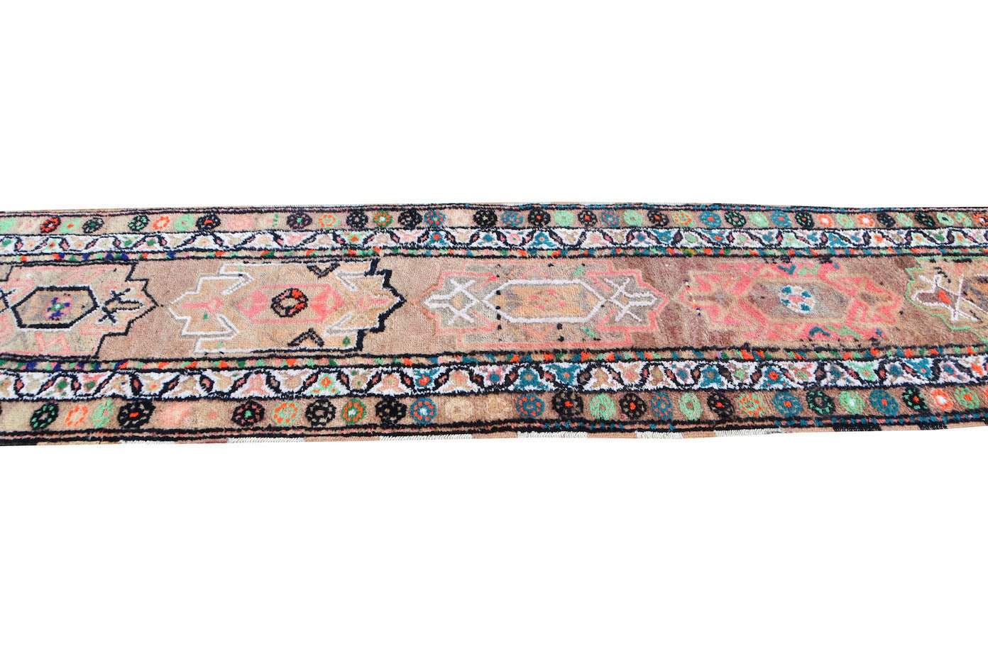 A vintage Kurdish Herki runner featuring tribal motifs in neon colors on a wool base.