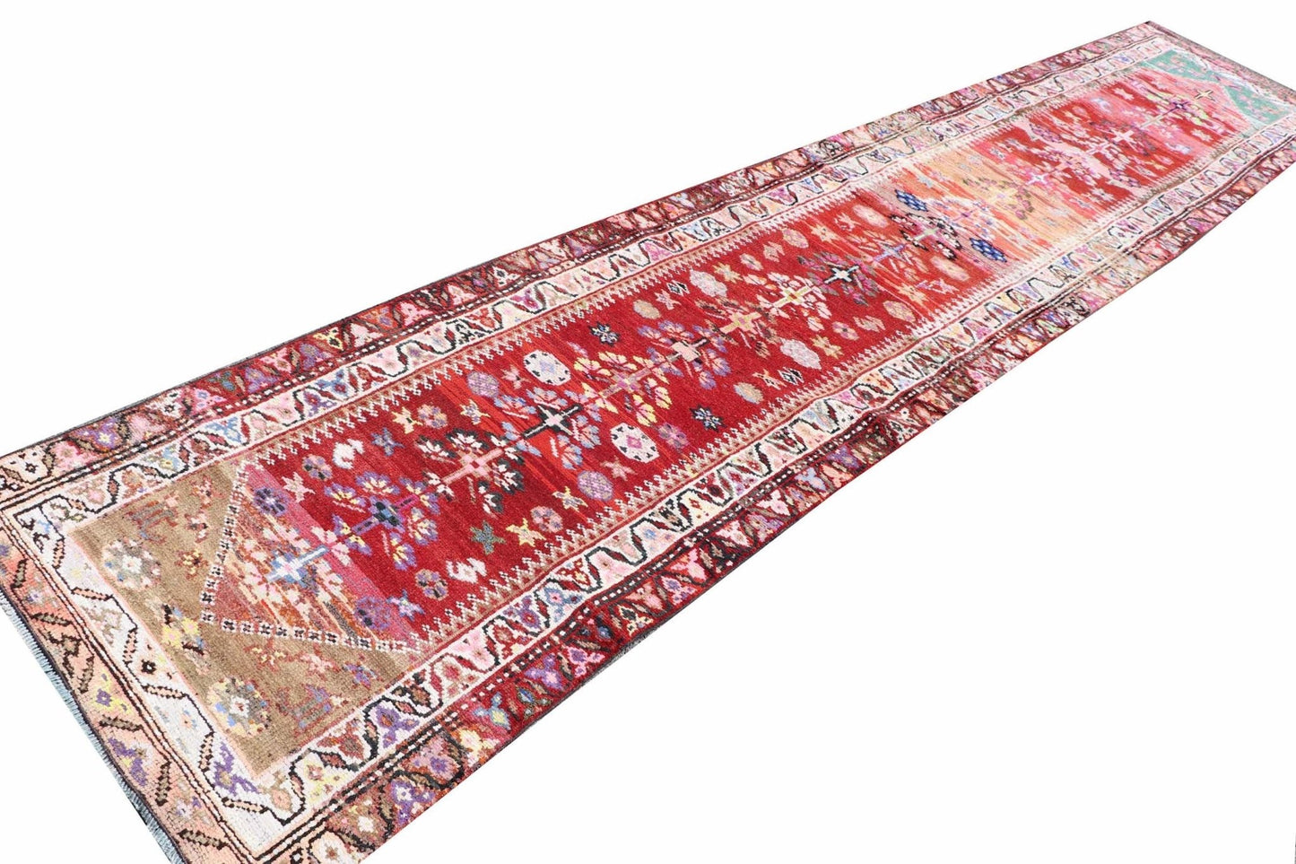 Vintage Kurdish Herki runner with red, pink, and tan tribal patterns.