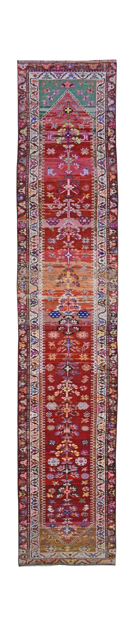 Vintage Kurdish Herki runner with tribal motifs and vibrant colors.
