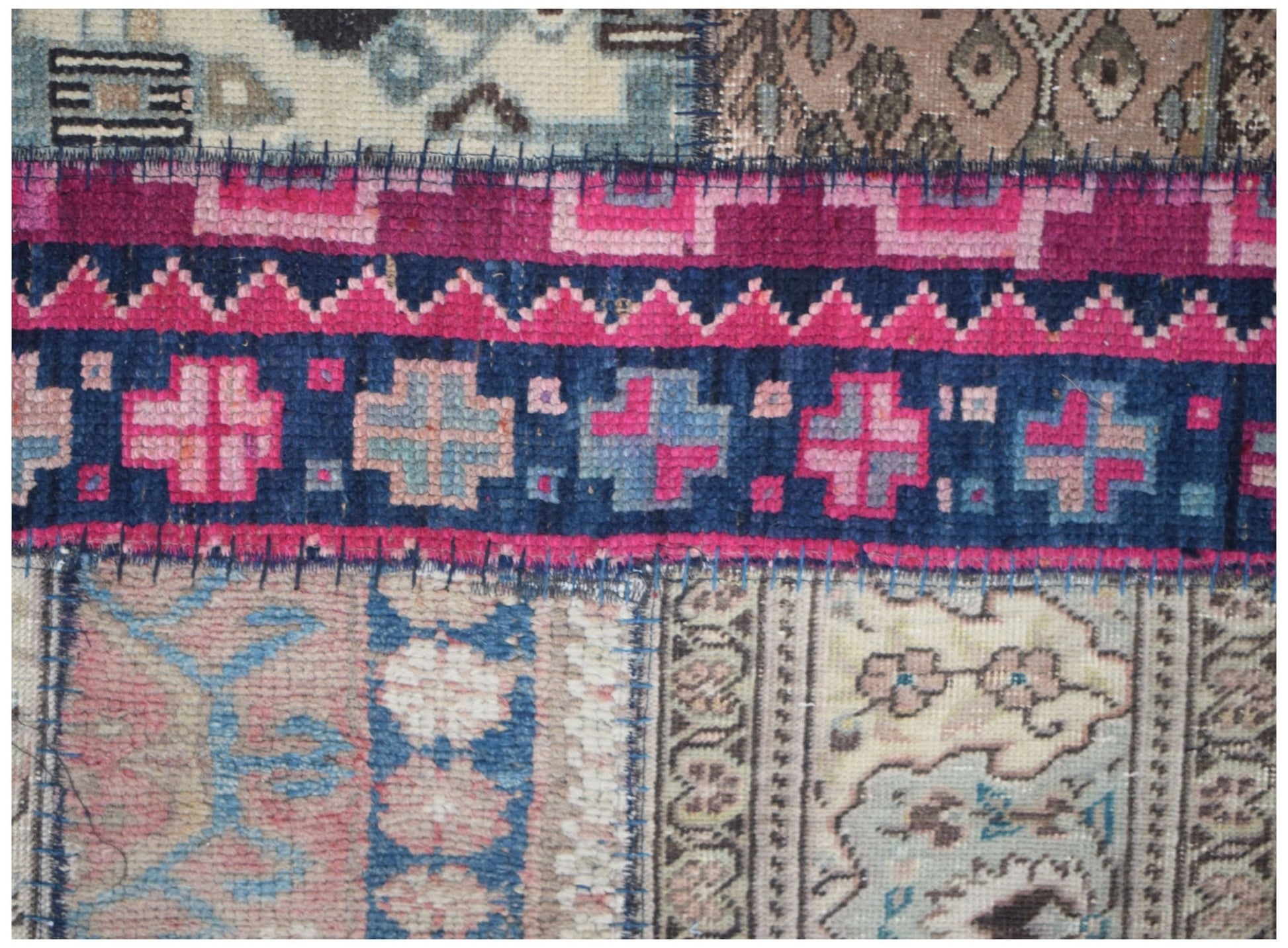 A handmade vintage patchwork runner featuring wool panels with geometric and floral patterns.