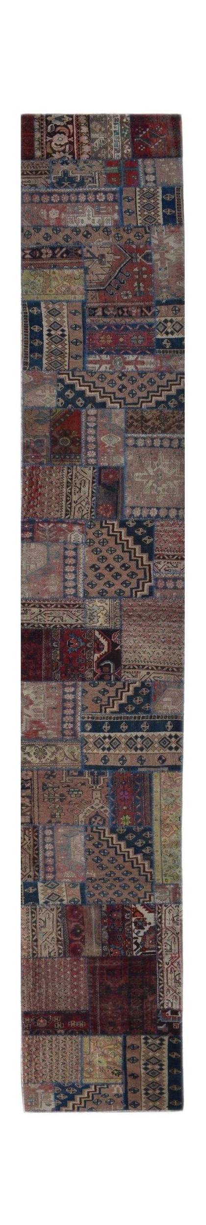 A handmade vintage patchwork runner rug featuring a variety of colorful, distressed wool patterns.