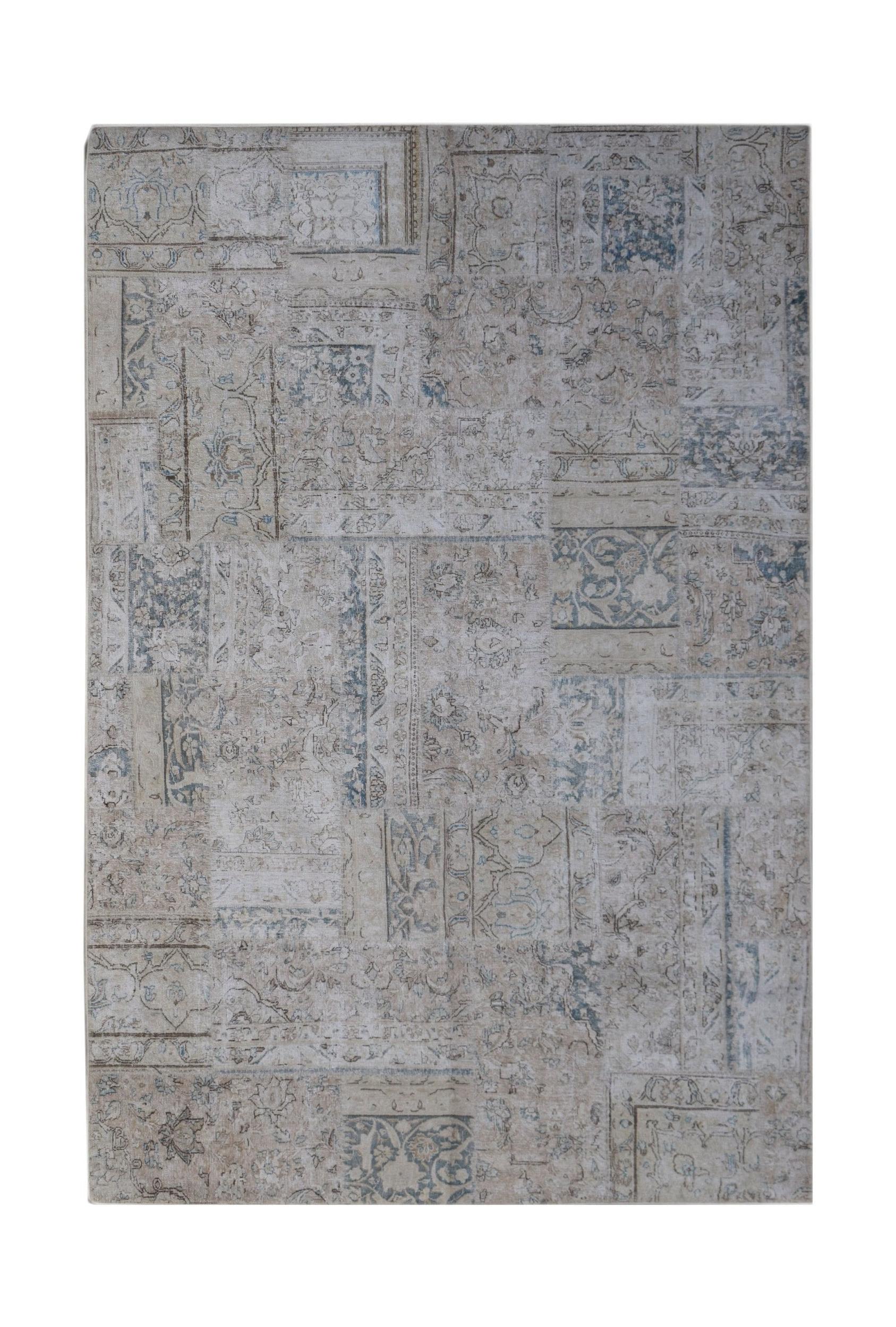 A handmade wool patchwork rug featuring a faded vintage design in shades of beige and blue.