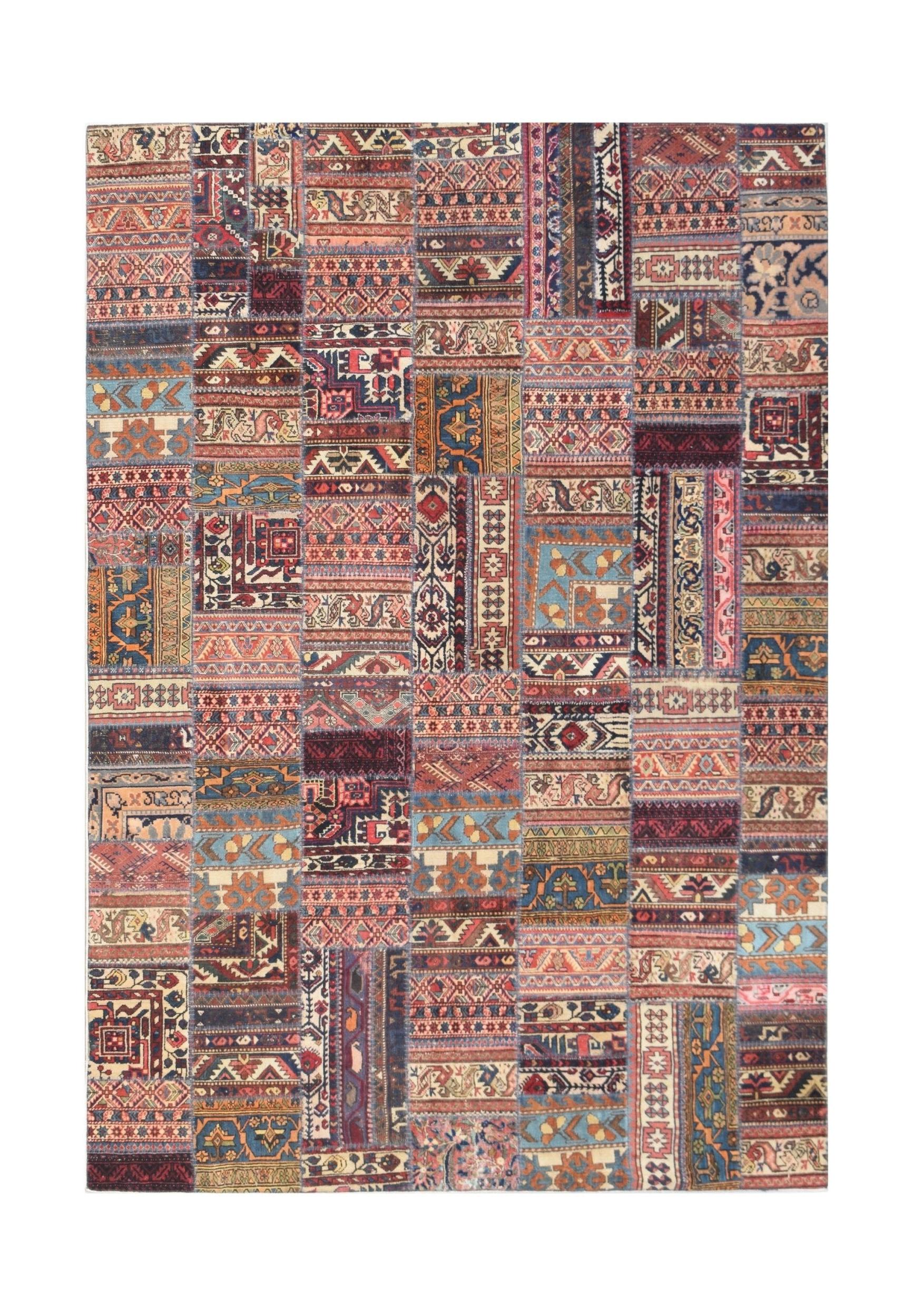 A rectangular handmade patchwork rug featuring a vibrant collage of vintage wool carpet fragments.