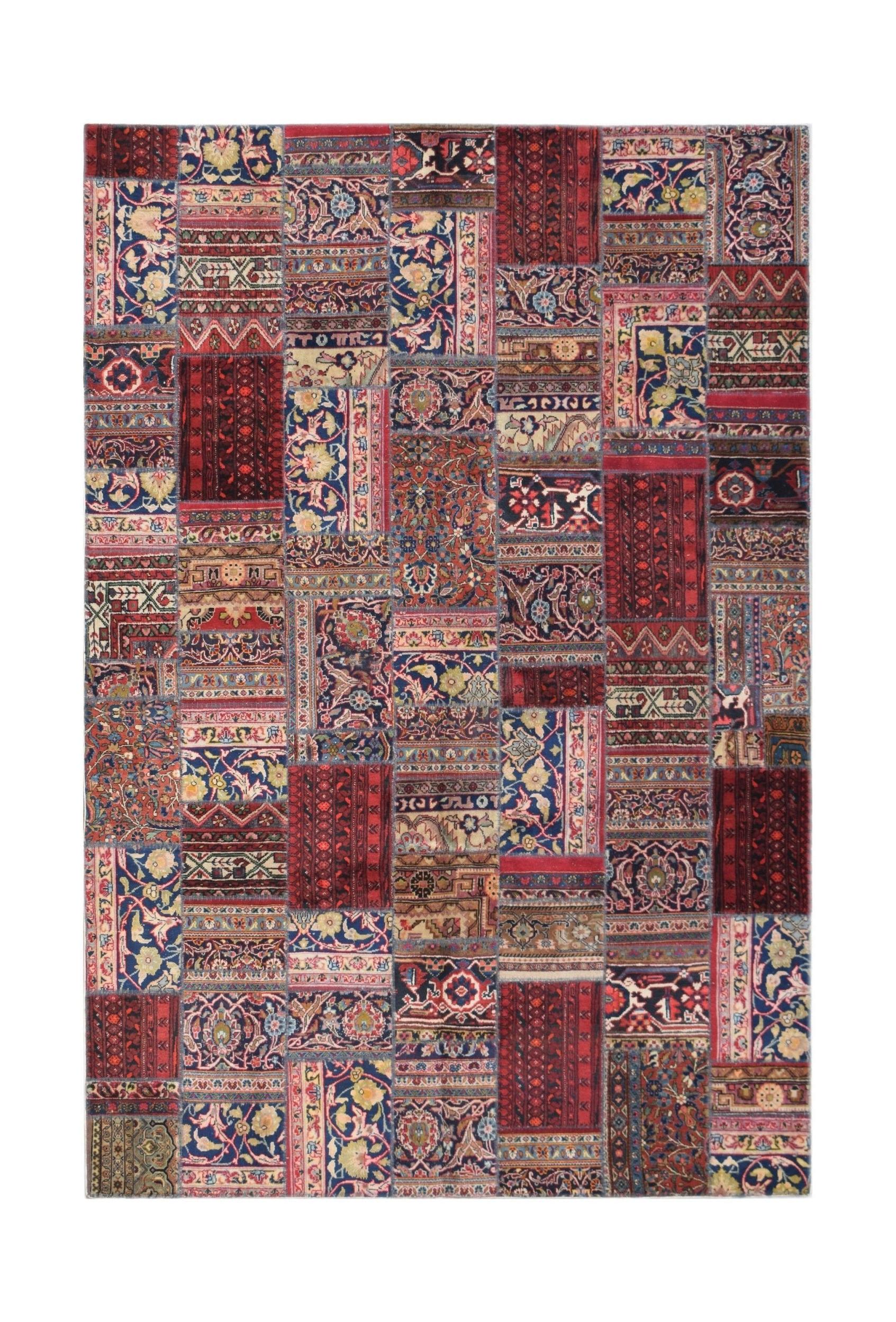 A rectangular handmade patchwork rug featuring a vibrant collage of vintage floral patterns.