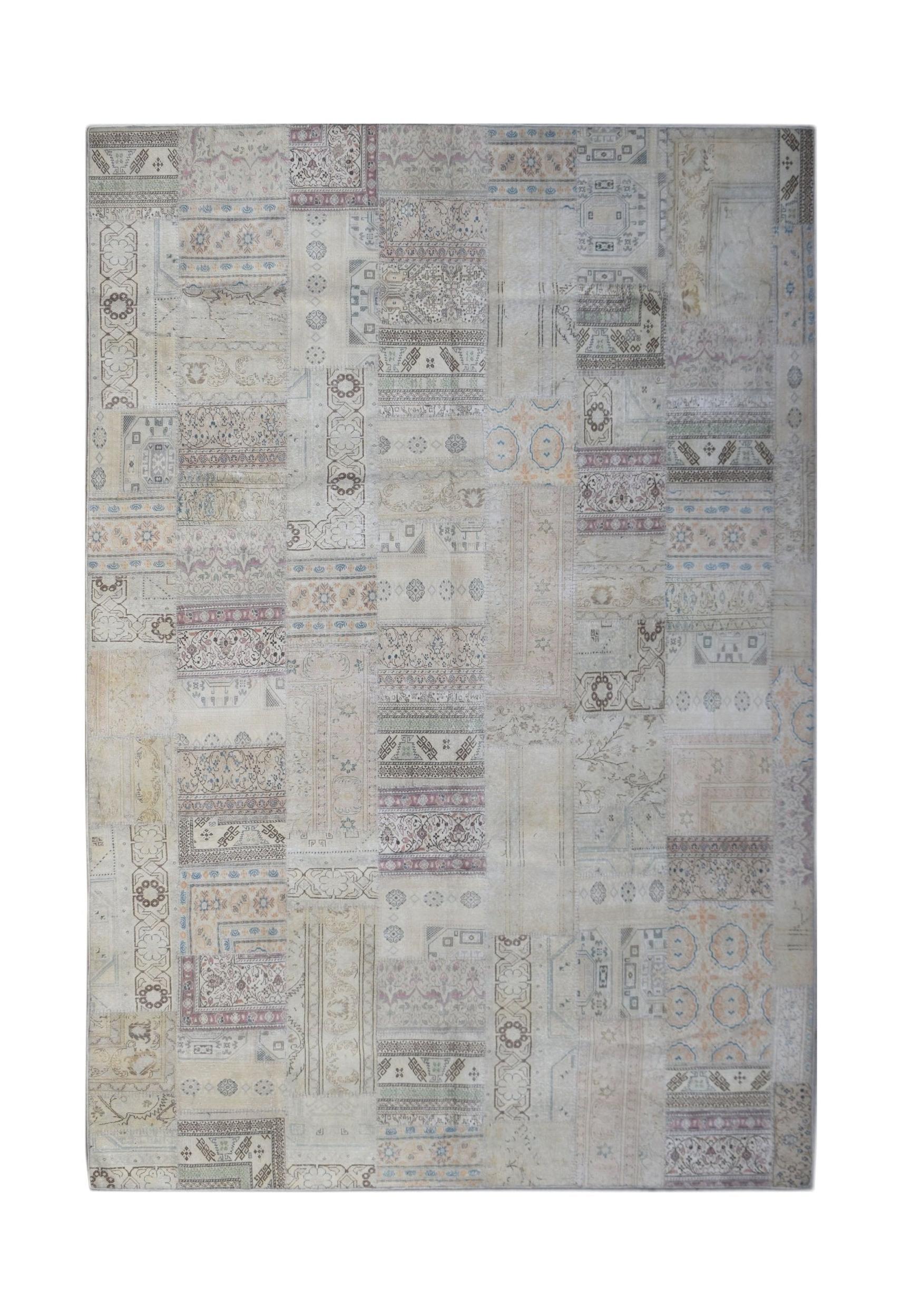 A handmade vintage patchwork rug featuring a neutral color palette with intricate patterns.