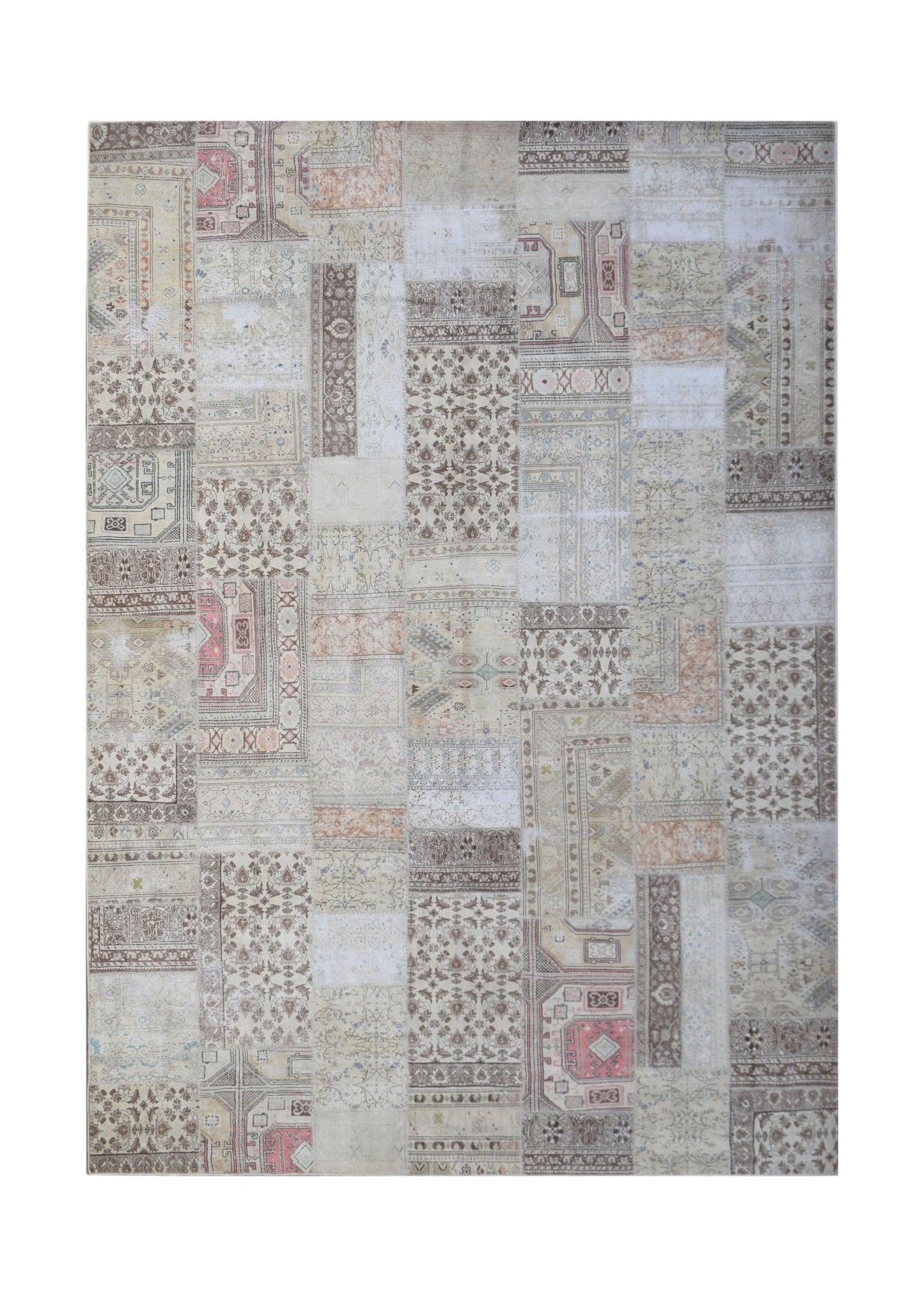 A handmade vintage patchwork rug featuring a neutral color palette with intricate floral patterns.