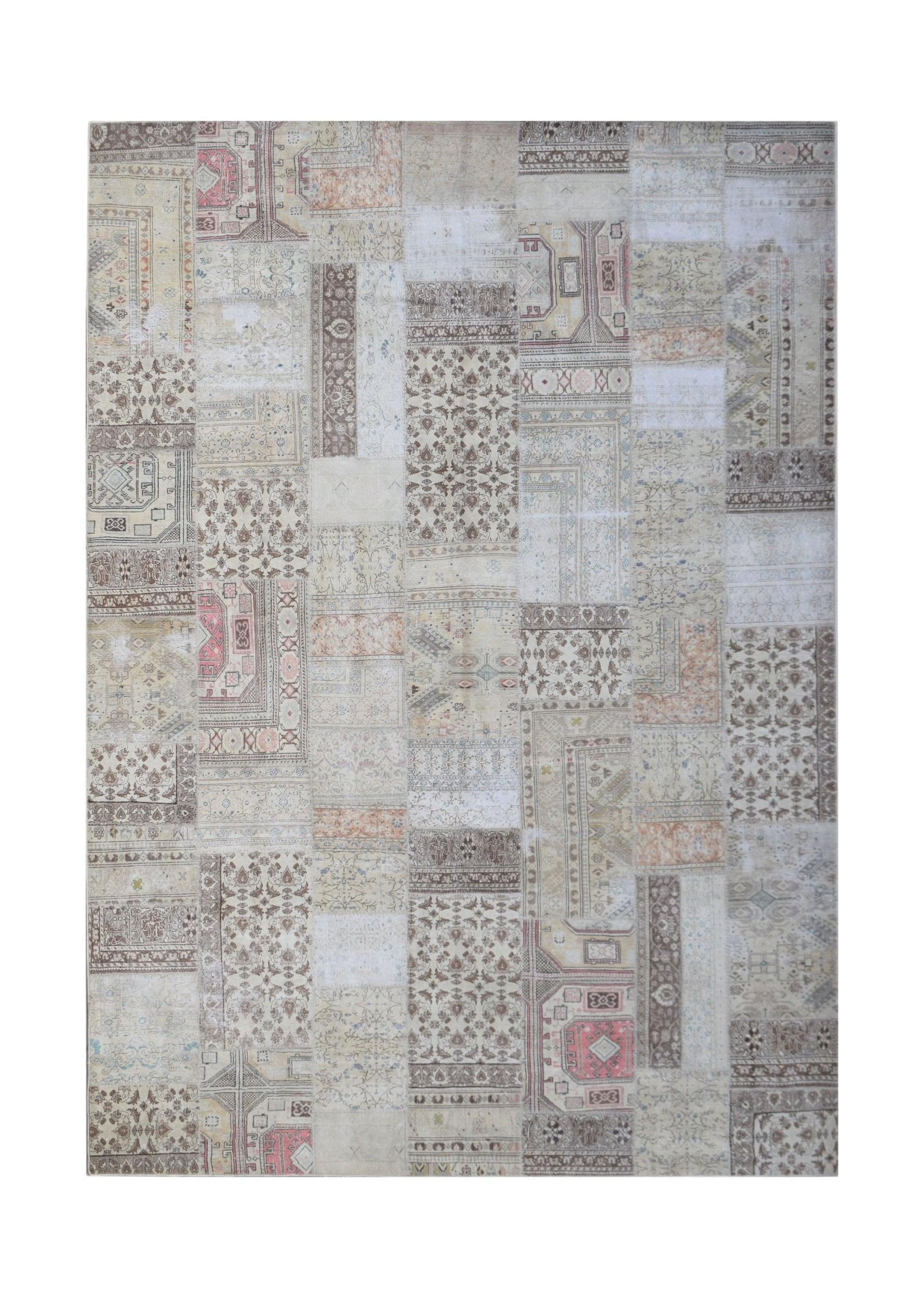 A handmade vintage patchwork rug featuring a neutral color palette with intricate floral patterns.