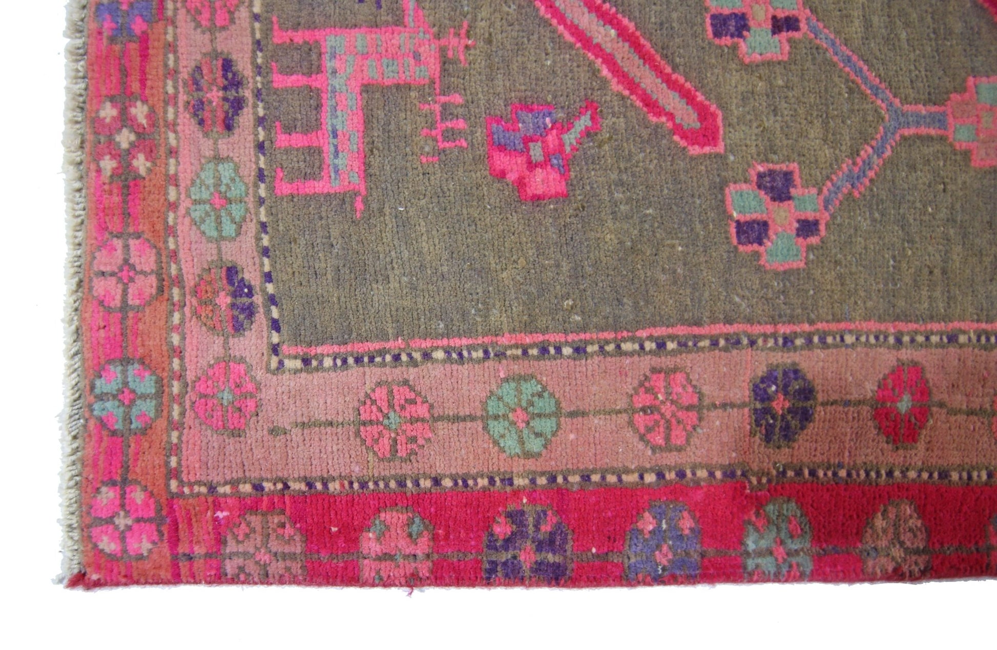 A vintage Persian Ardabil rug featuring a grey field with vibrant pink, purple, and green motifs.