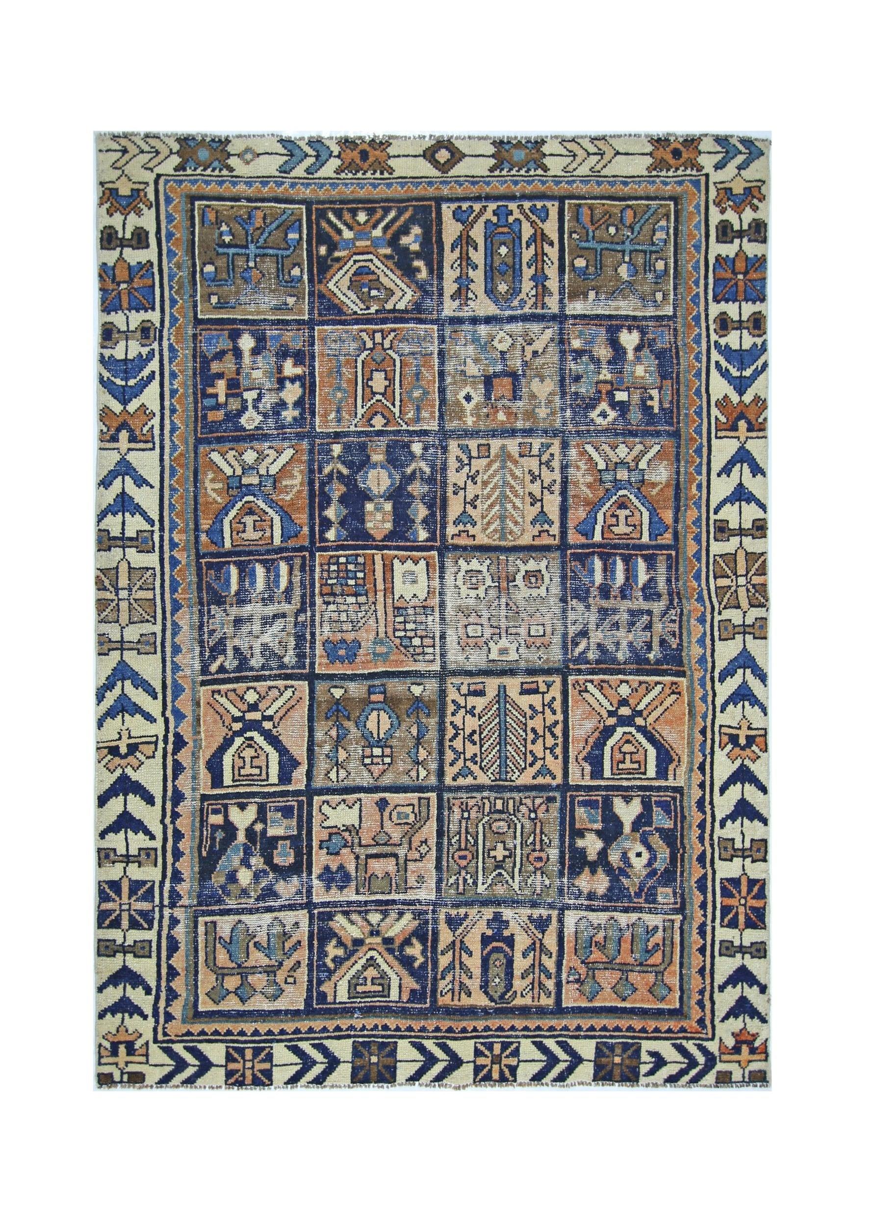 A vintage Persian Bakhtiari rug featuring a grid of geometric tribal motifs in blue and tan tones.