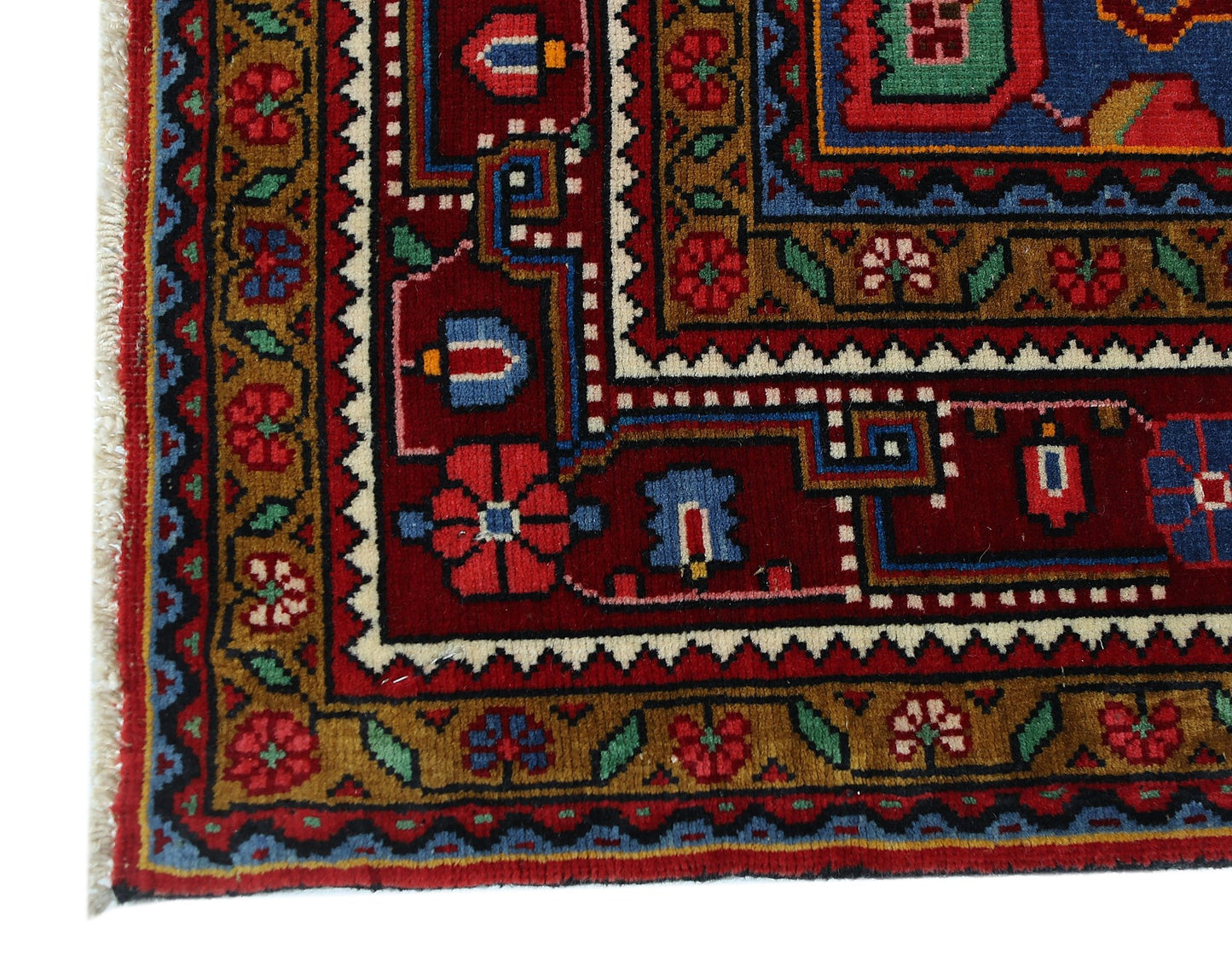 A vintage Persian Bakhtiari rug featuring intricate geometric and floral patterns in red and blue.