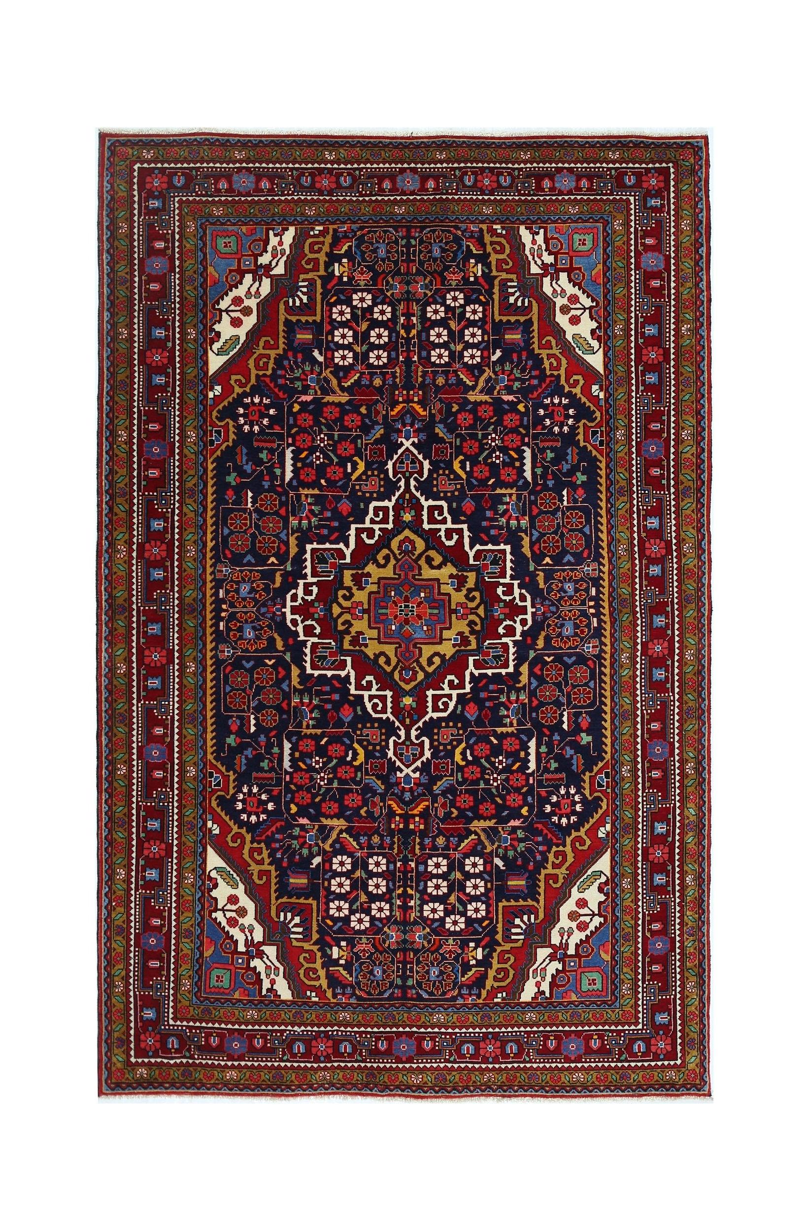 A vintage Persian Bakhtiari rug featuring a central medallion on a dark blue field with floral motifs.