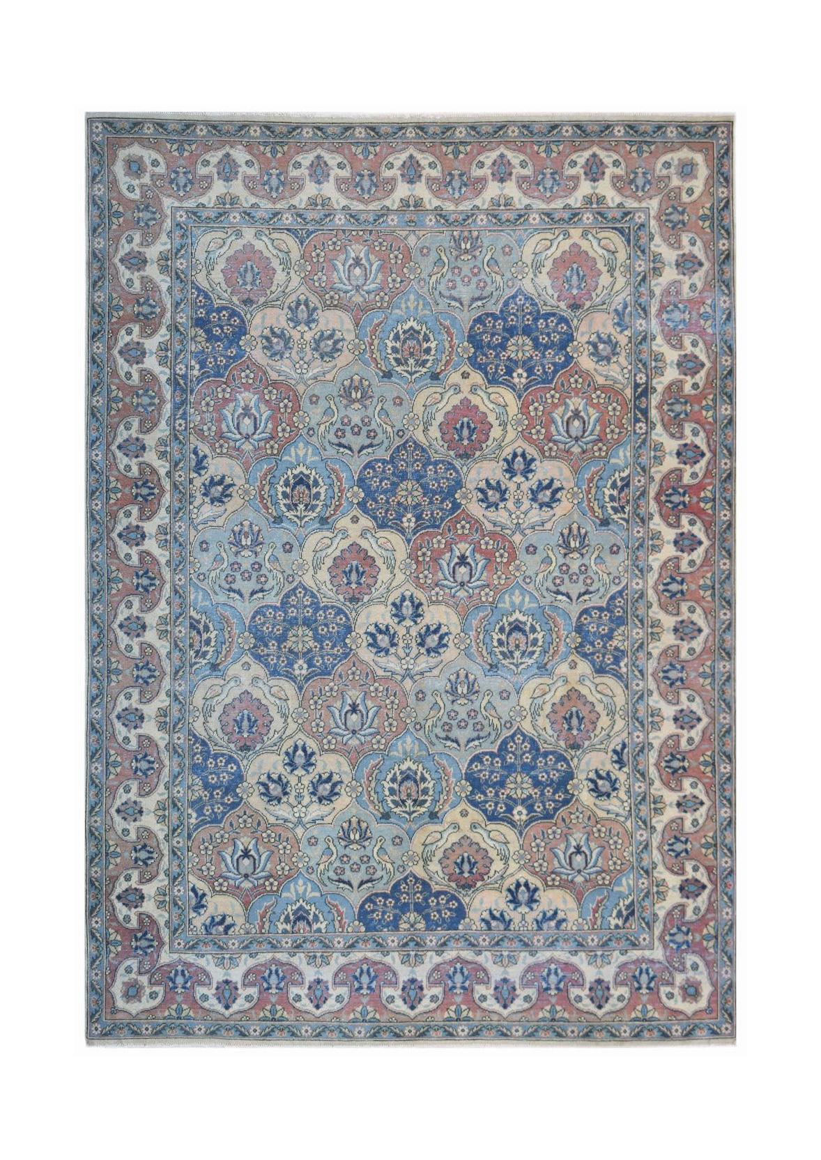 Vintage Persian Bakhtiari rug featuring a floral medallion pattern in blue, pink, and cream tones.