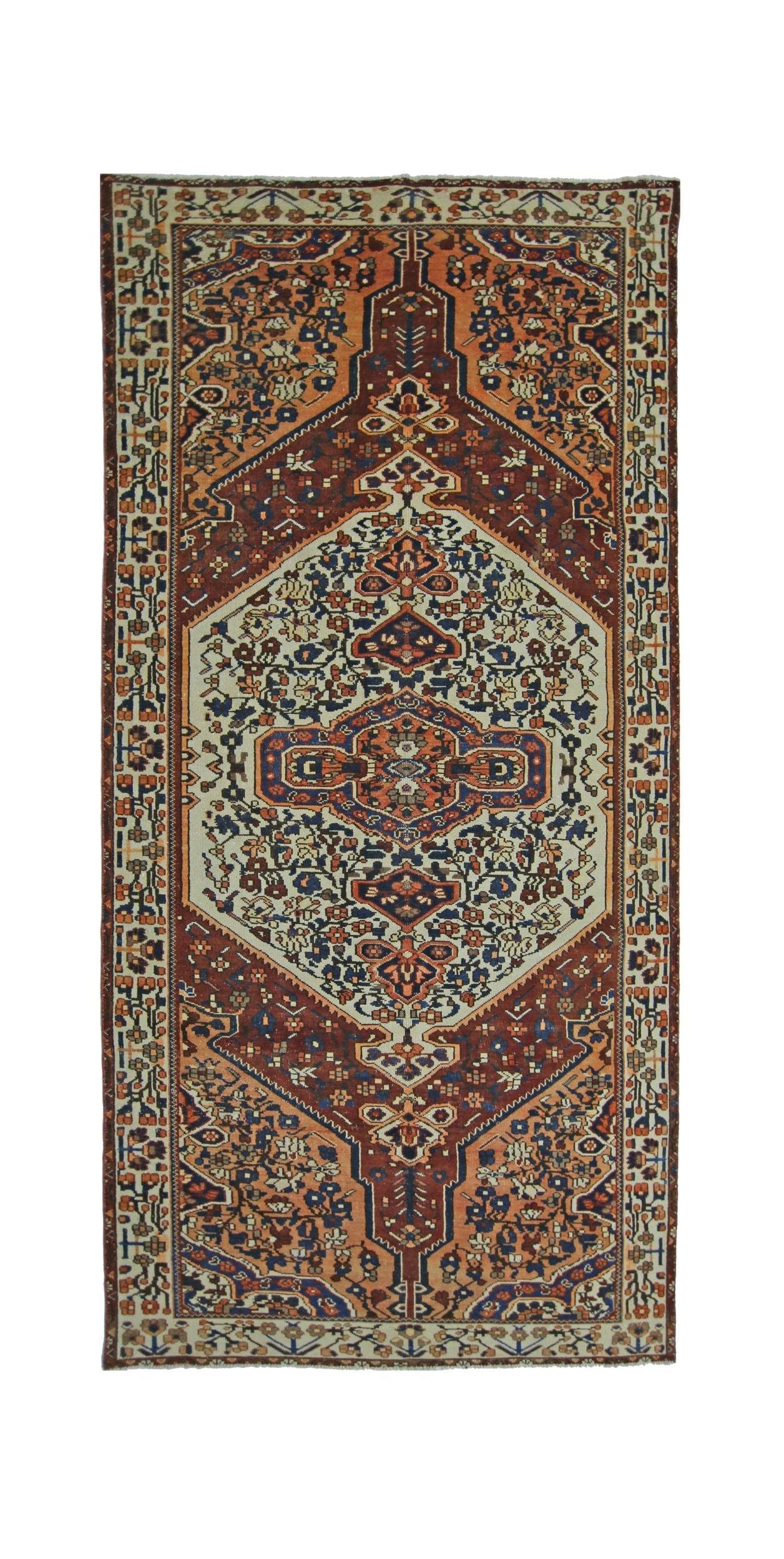 A vintage handmade Persian Bakhtiari rug featuring a central medallion on a rust and cream field.