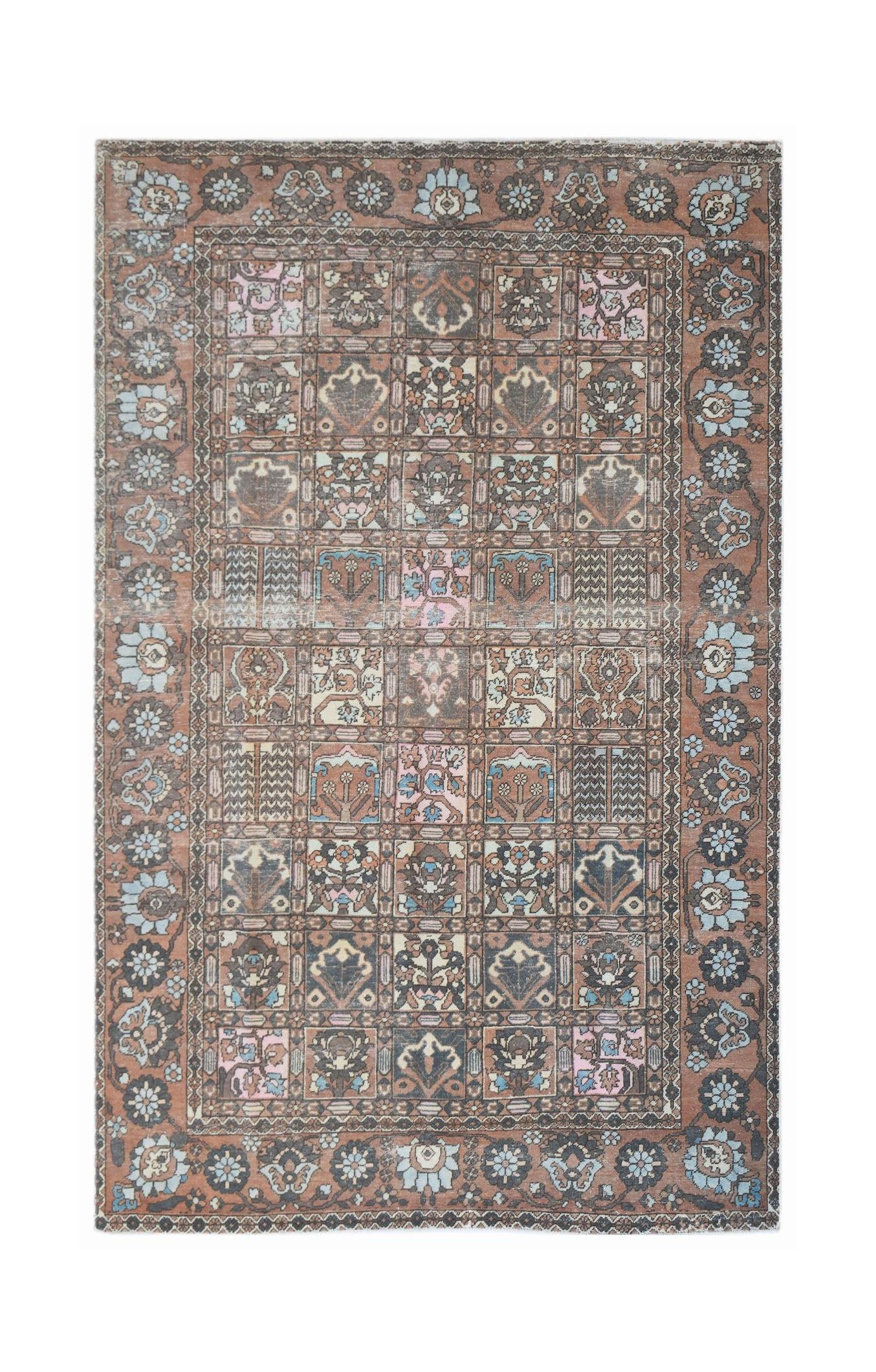 A vintage Persian Bakhtiari rug featuring a grid of floral motifs in muted earth tones and blue.
