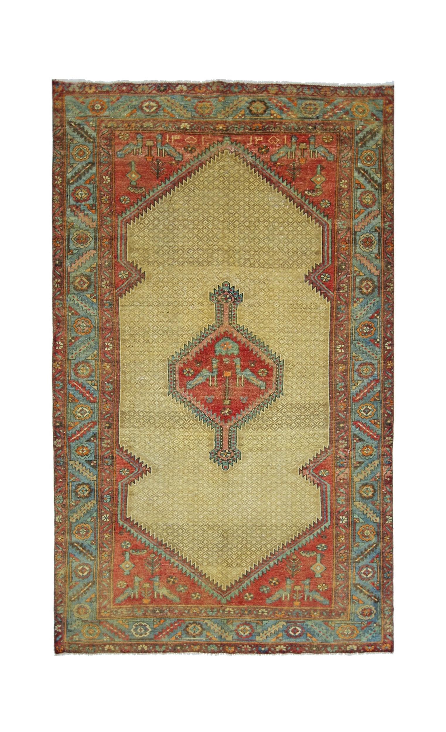 A vintage Persian Bibikabad rug featuring a central diamond medallion on a beige field.