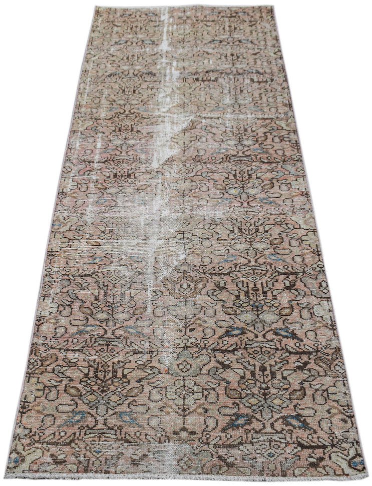 A vintage handwoven Persian Hamadan runner featuring a faded floral pattern in muted earth tones.