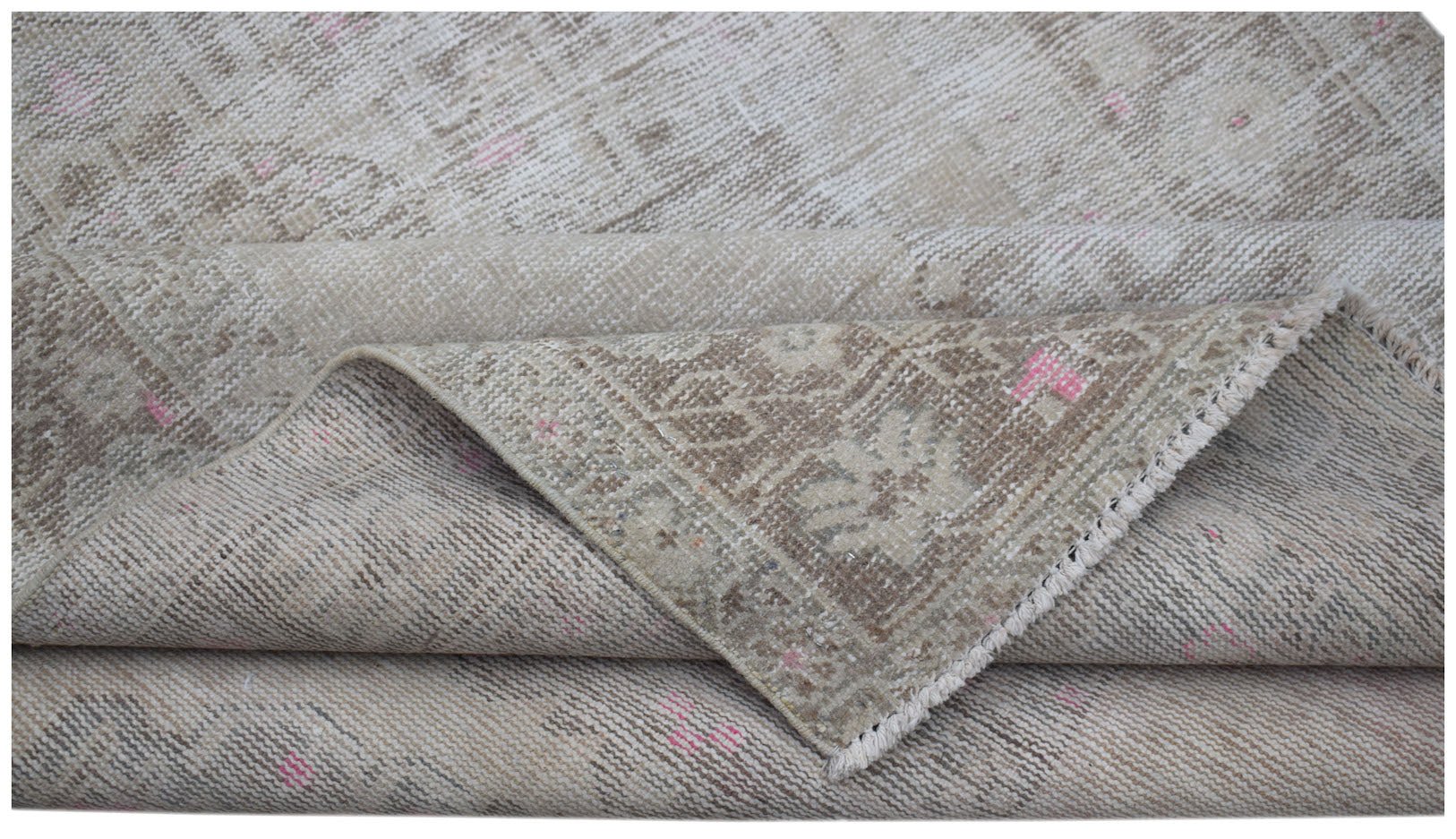 A handwoven vintage Persian runner featuring a faded beige pattern with subtle pink accents.